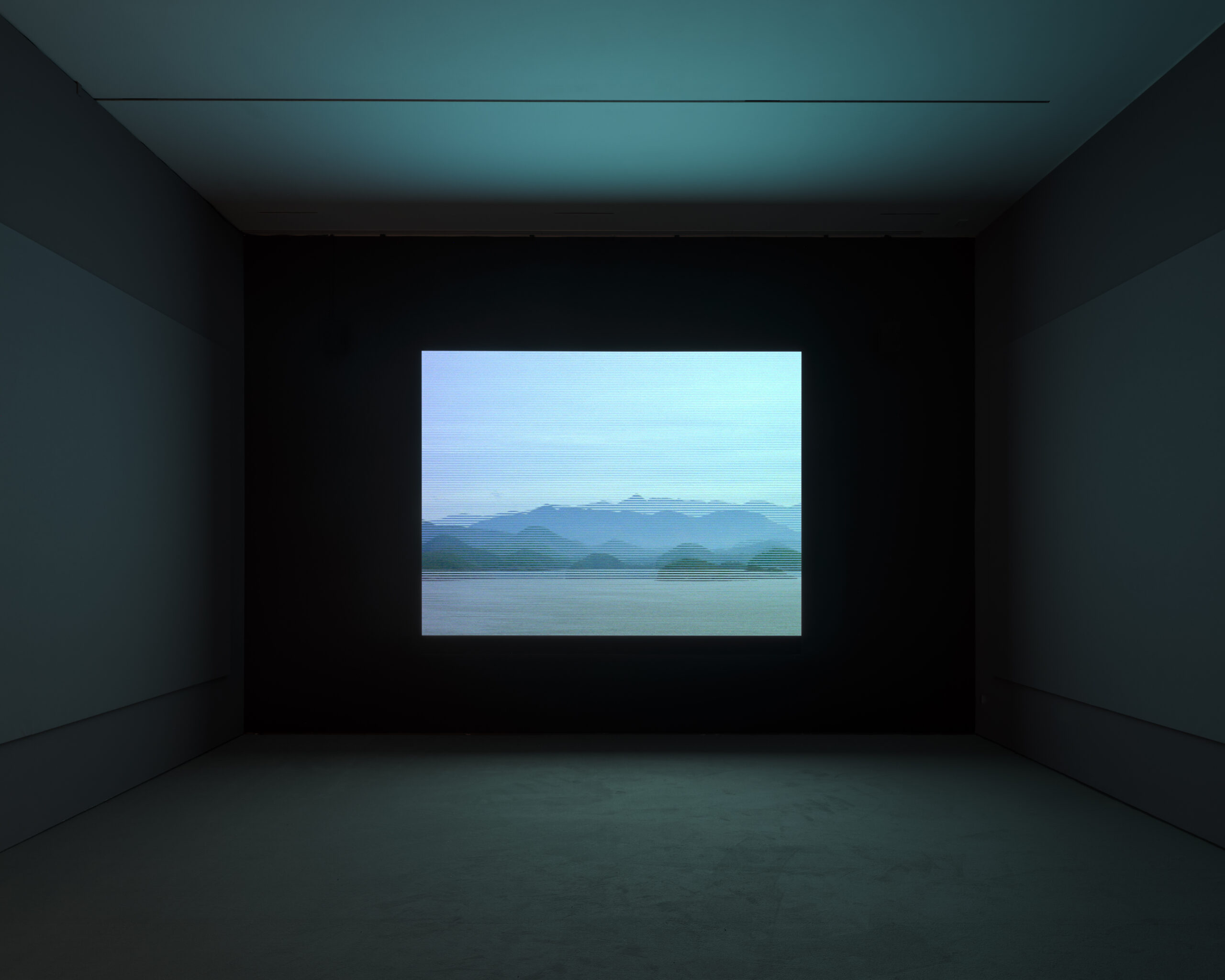 Video projection with mountain ranges across the horizon line