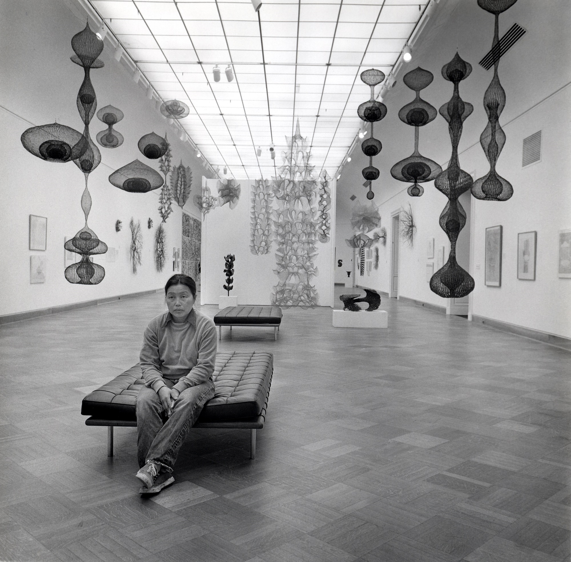 Ruth Asawa in the gallery with her artwork