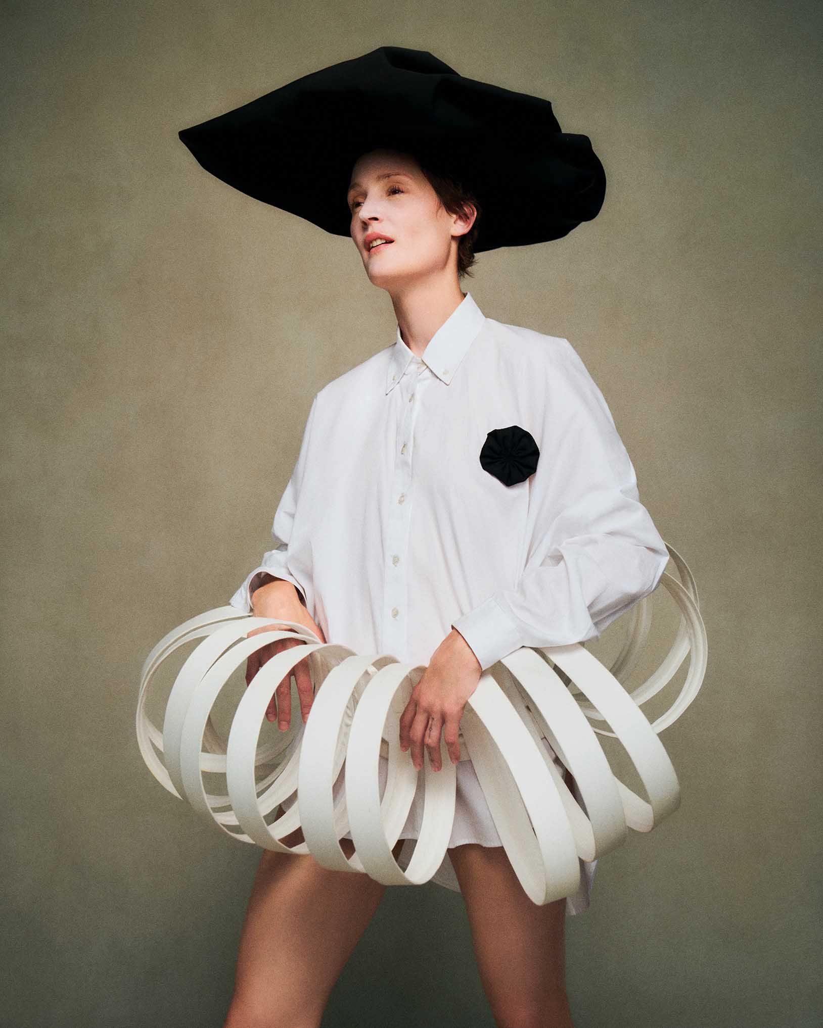 Vicky Krieps, Marco Ribeiro top and skirt, Noel Stewart hat, contemporary fashion, editorial portrait