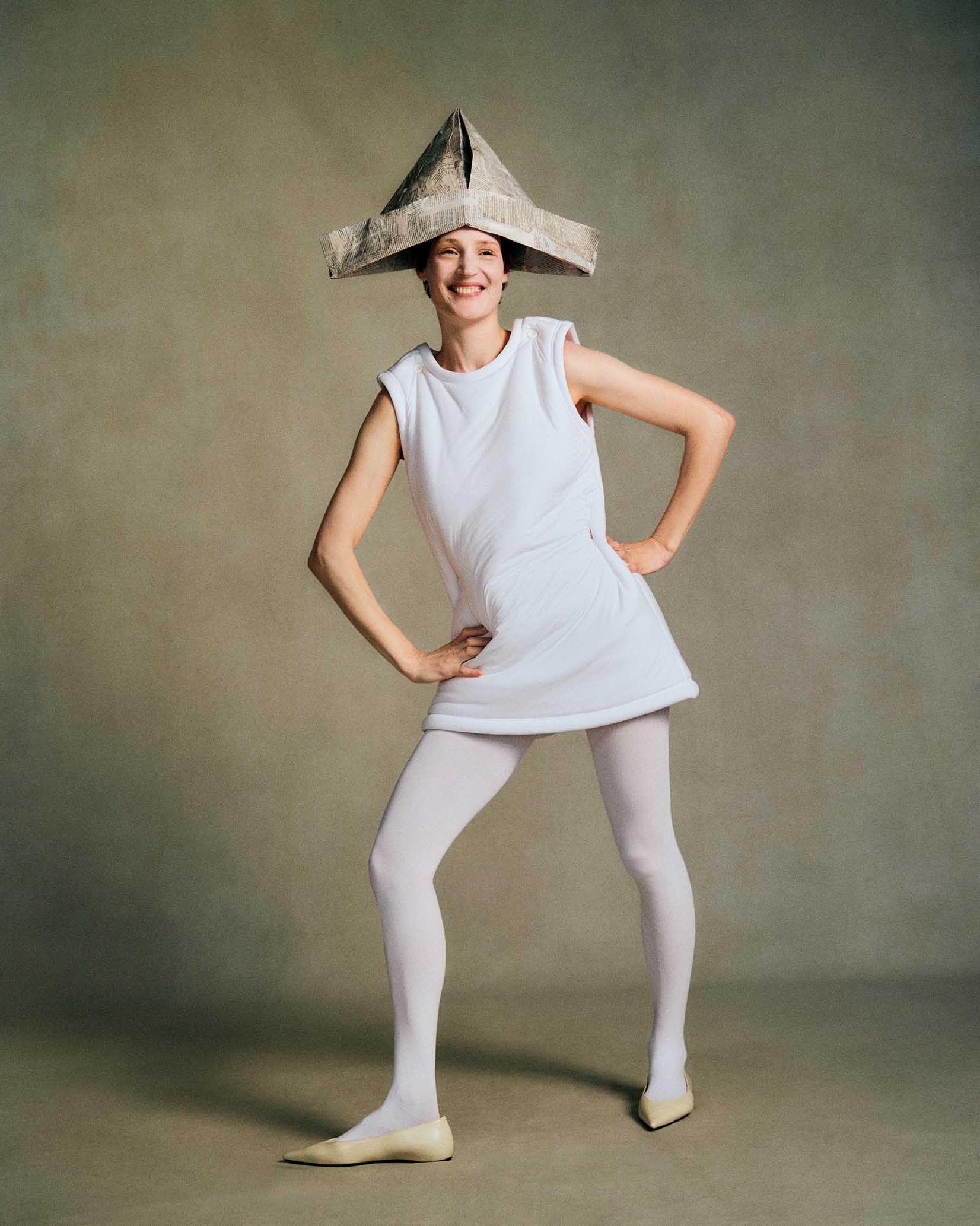 Vicky Krieps, Issey Miyake dress, Abi Wood hat, tights and shoes by stylist, avant-garde fashion, editorial portrait