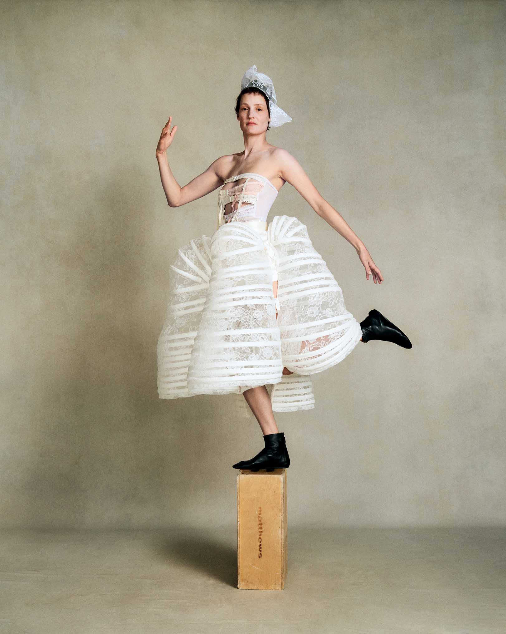 Vicky Krieps, Transe Paris top, Comme des Garçons skirt from 20 Age Archive, Chylak head collar, Falke socks, Le Monde Beryl shoes, avant-garde fashion, editorial portrait