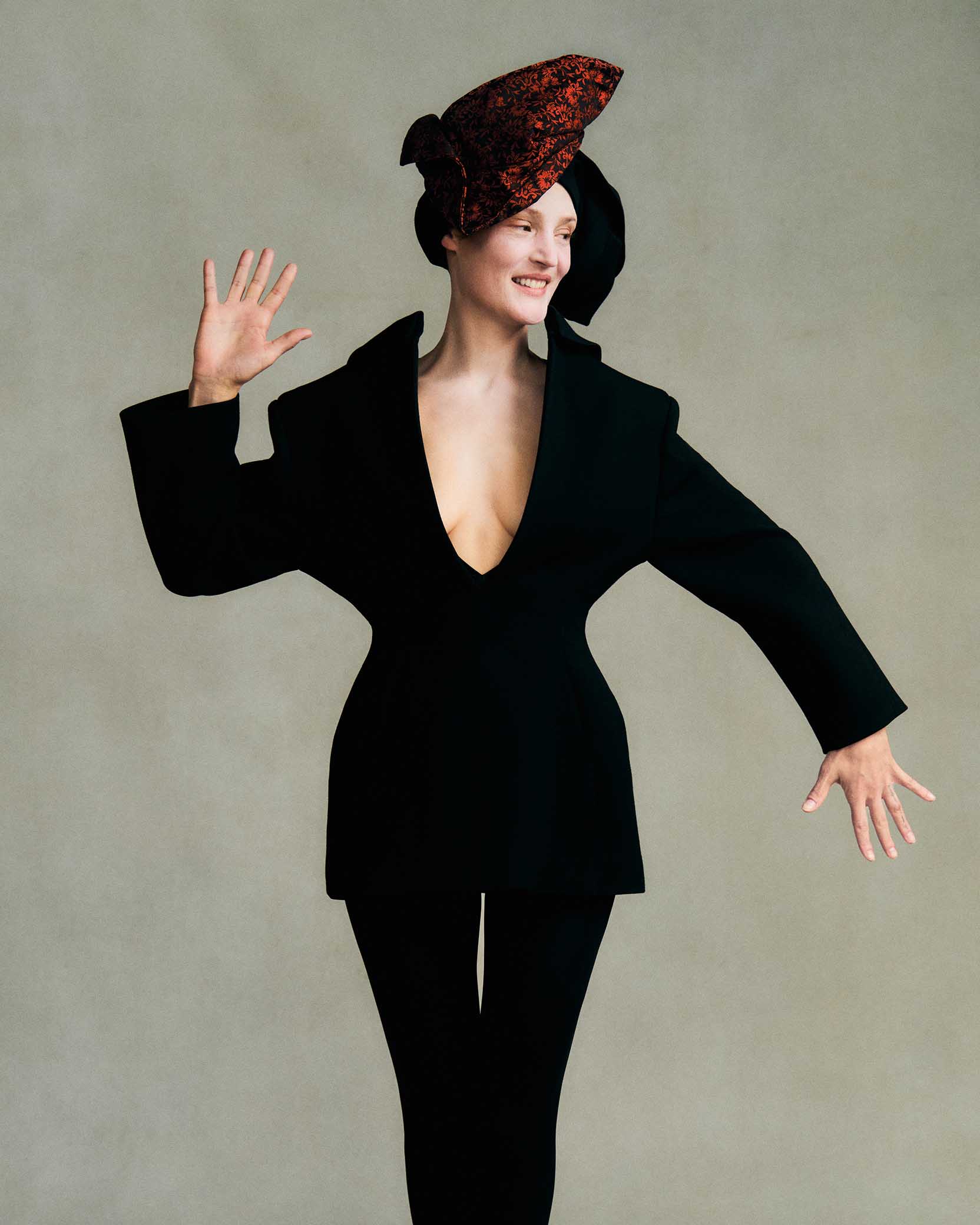 Vicky Krieps, Givenchy jacket by Sarah Burton, Benny Andallo hat, Heist tights, black headpiece by stylist, avant-garde fashion, editorial portrait