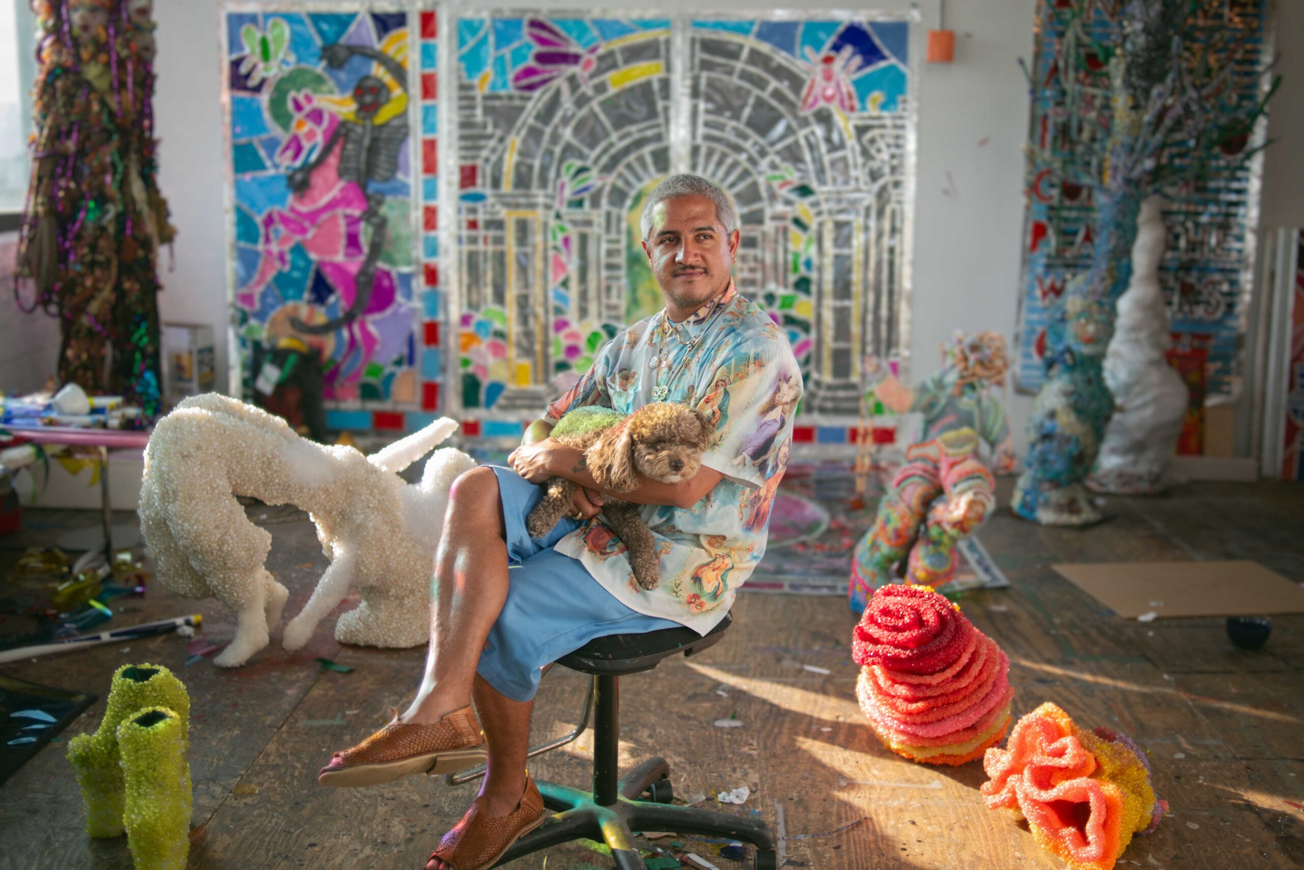 Raúl de Nieves in his Williamsburg studio with his dog, Penguini.