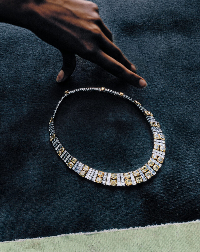 Yellow Cushion Cut with White Baguette andRound Diamond Necklace set in yellow and white gold.