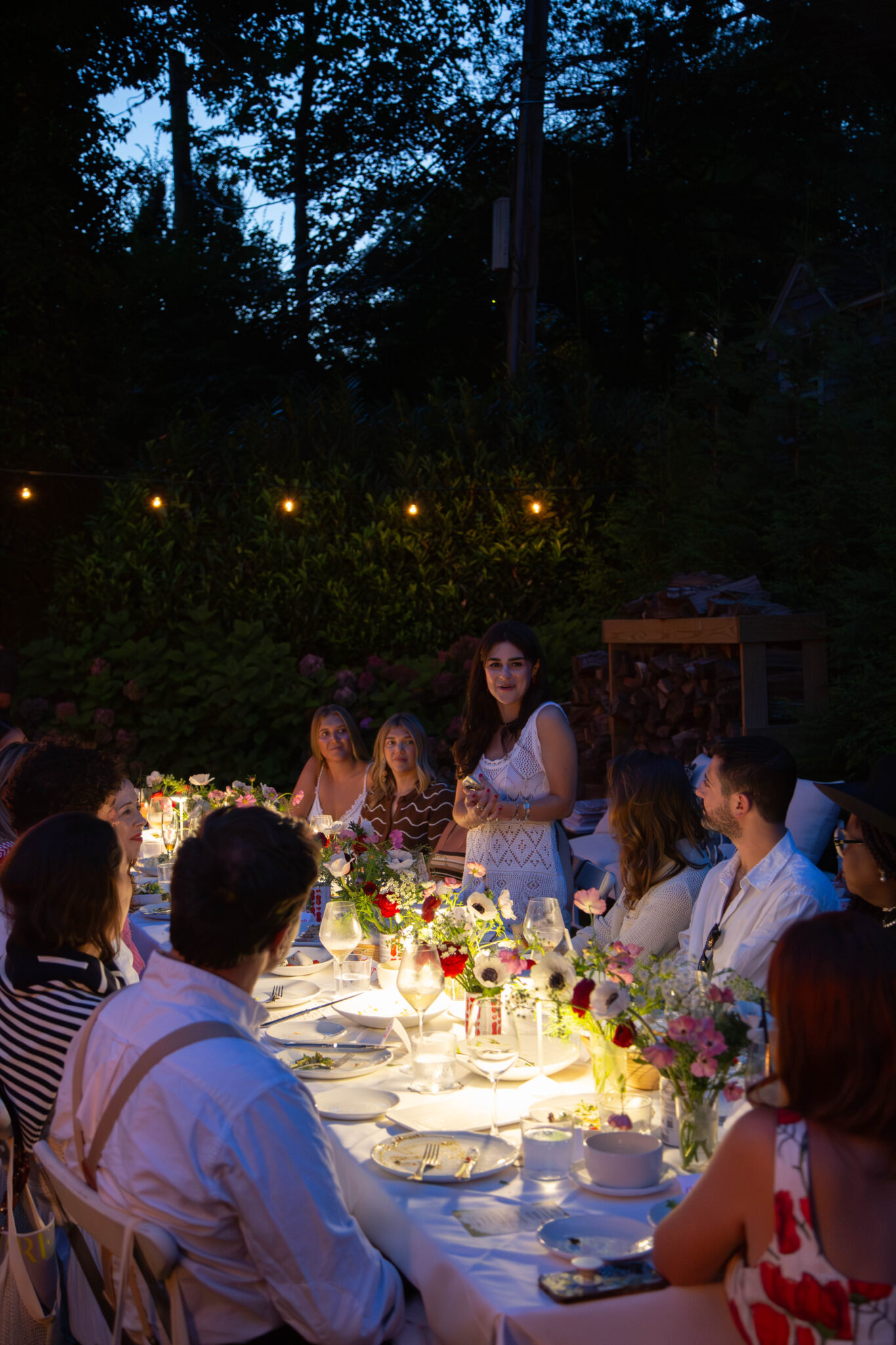 Alex Bass delivering remarks in the Hamptons