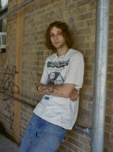 man standing near a wall