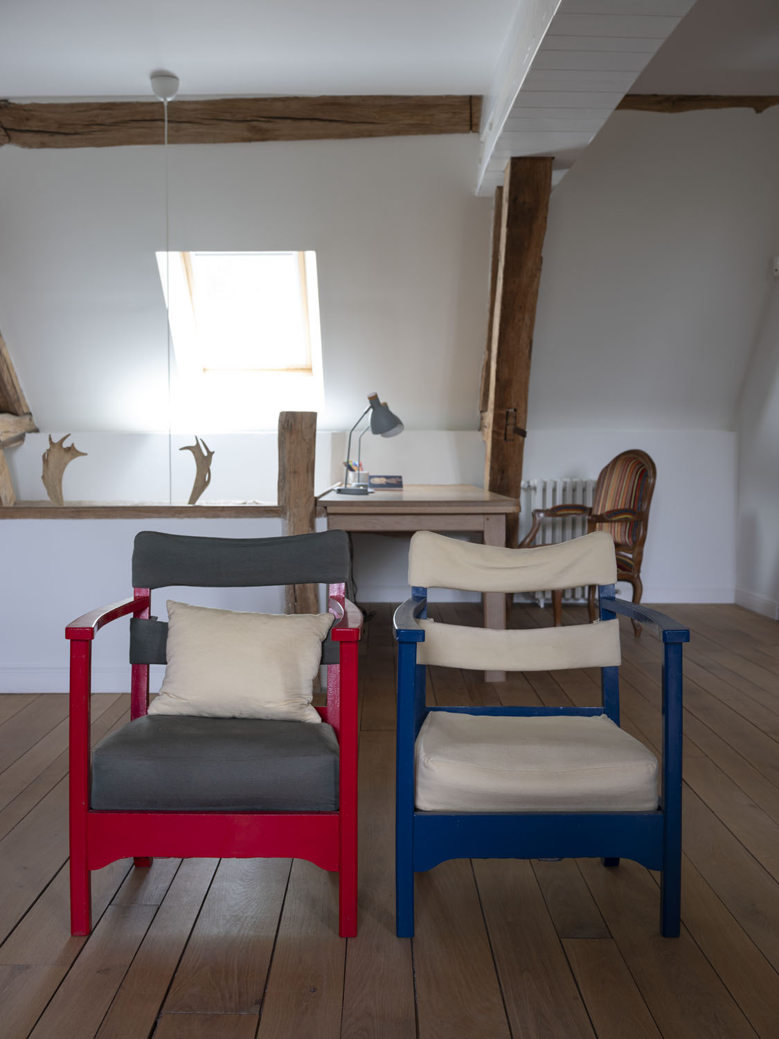 The midcentury chairs in the family room, reupholstered in the \\\