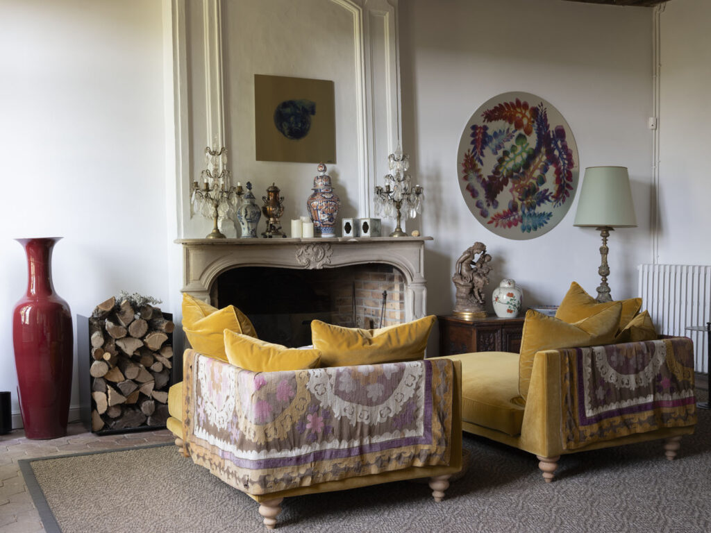 The petit salon features a cyanotype by Mathilde de l'Ecotais (left) and Moon by designer Bethan Laura Wood (right).