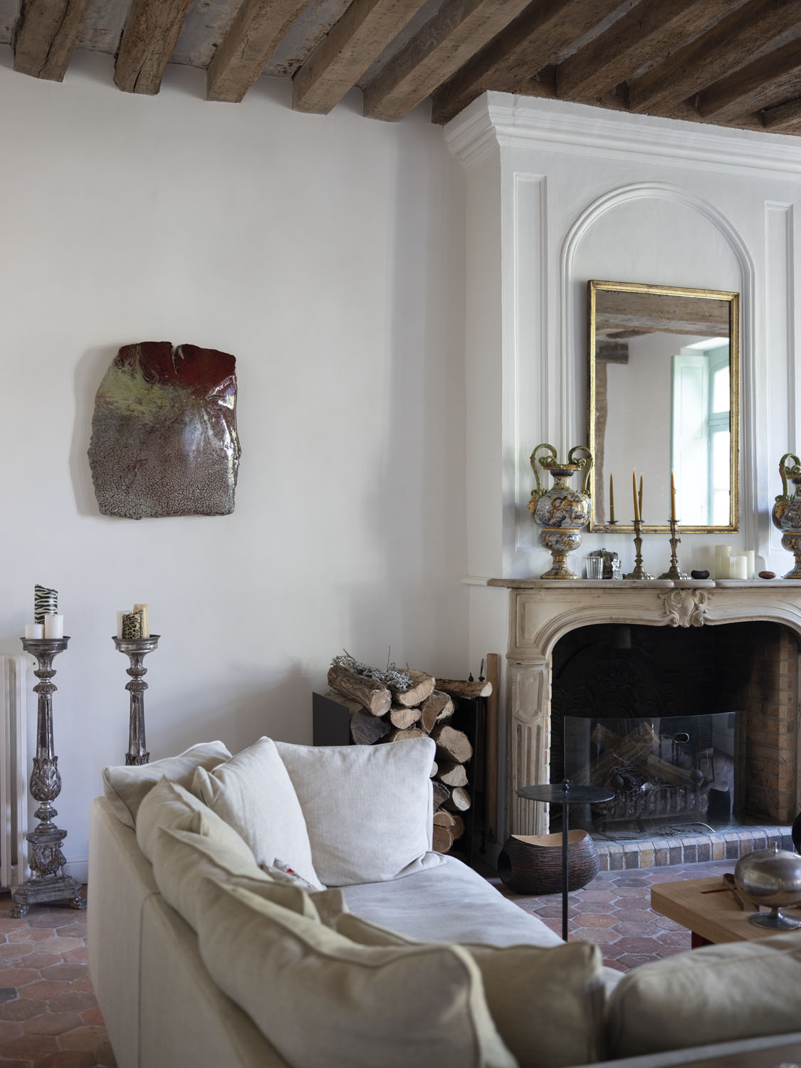 The silver candlesticks, Italian vases, and brass mirrors are 18th-century antiques from de Buffévent\\\