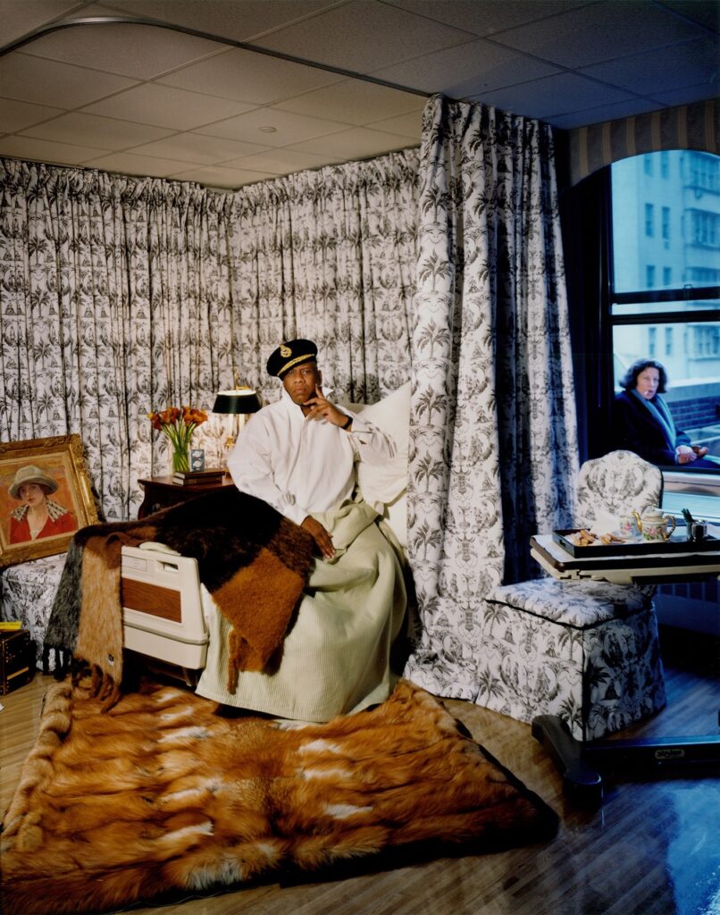 Andre Leon Talley and Fran Lebowitz in a redecorated hospital room after his knee surgery. Image courtesy of Jason Schmidt.