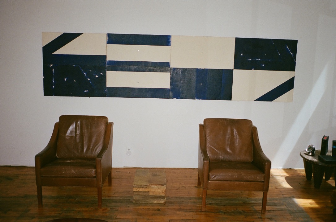 That work behind the two armchairs is my husband's. It's from a series from 15 years ago that was based on directions: North, East, West, South. He did a lot of work from that concept, and this one has stayed in our home since. My company is called NEWS from that series. When I was looking for a name for the business, it made so much sense, because I work with designers from around the world.