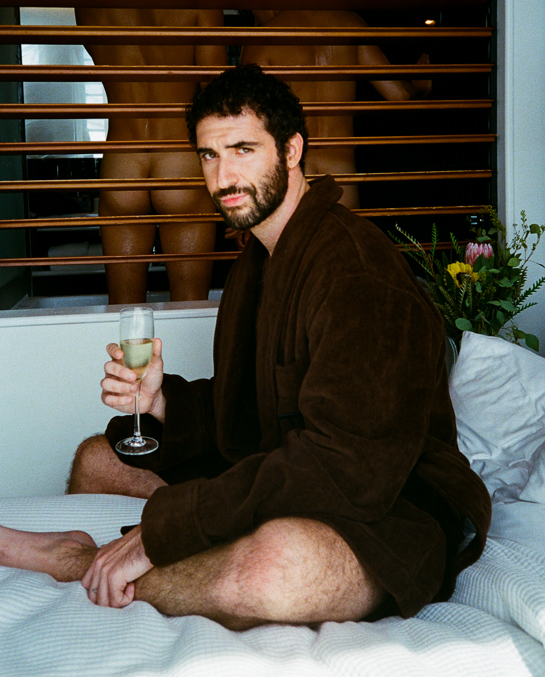 Jordan Firstman at the Standard Hotel, wearing a robe by Tom Ford, shot by Matías Alvial