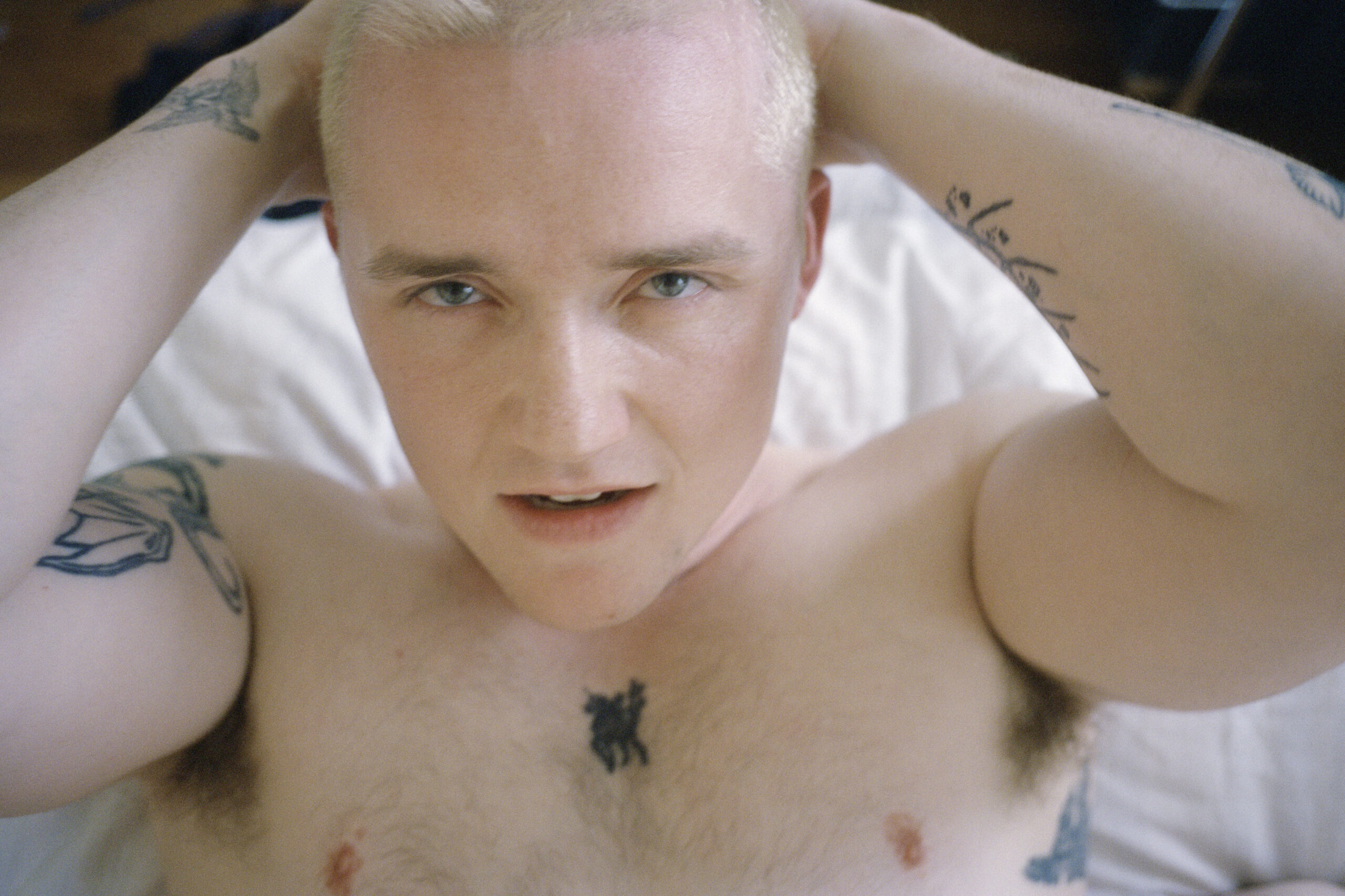 Photo by Sam Penn, Max in bed, 2025. 