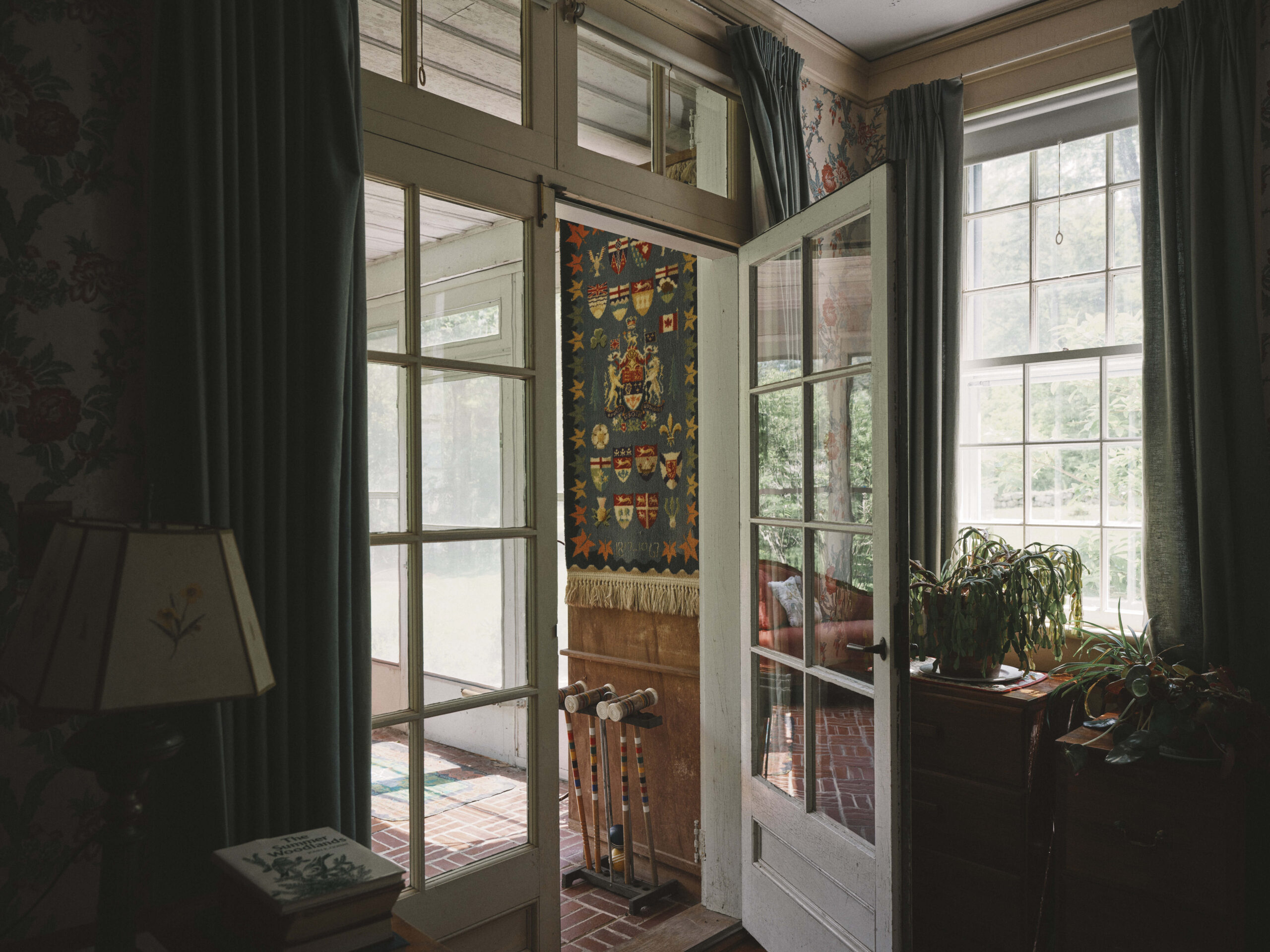 Tapestry and croquet mallets in entryway