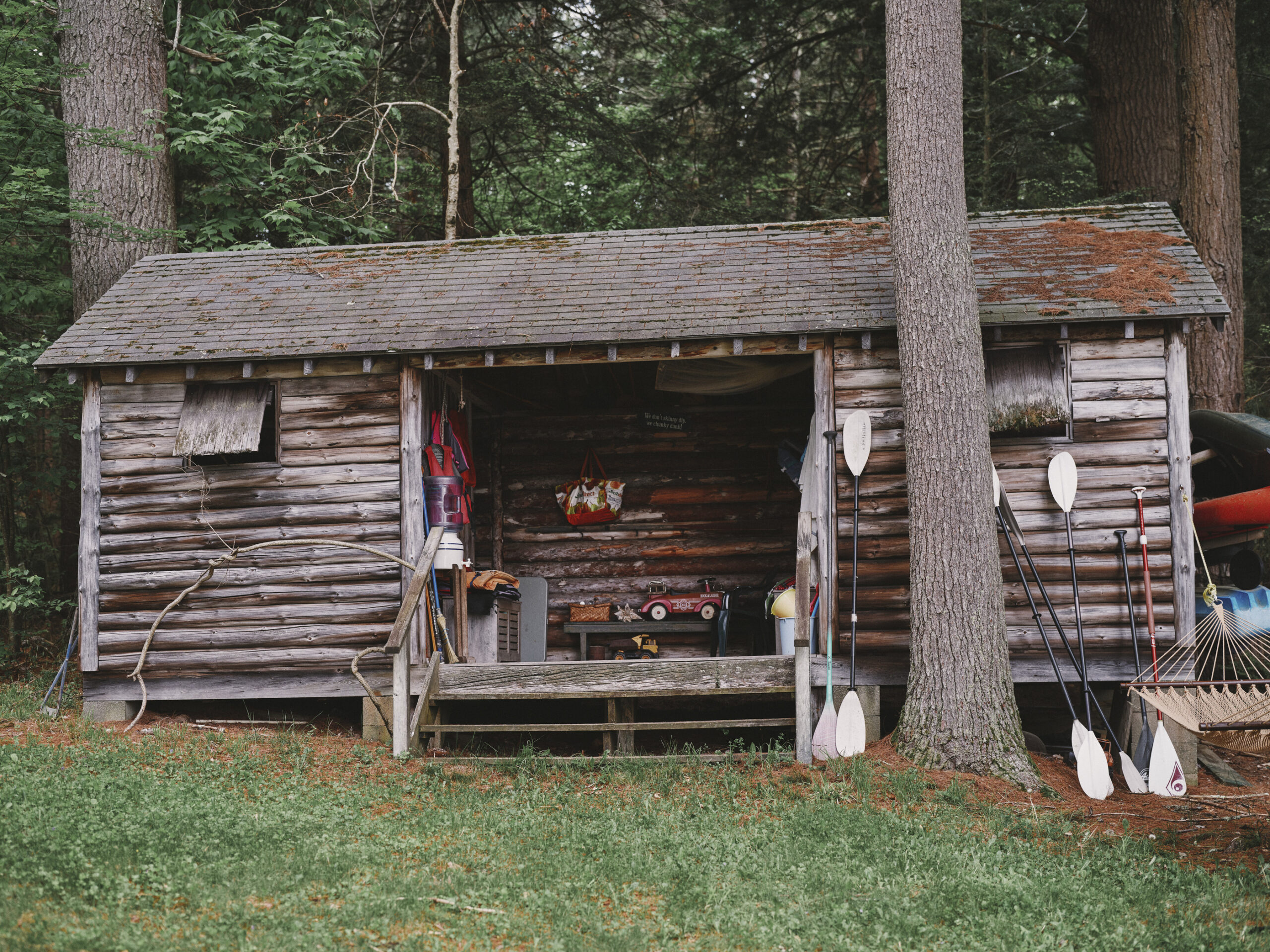 Log cabin changing house by the lake