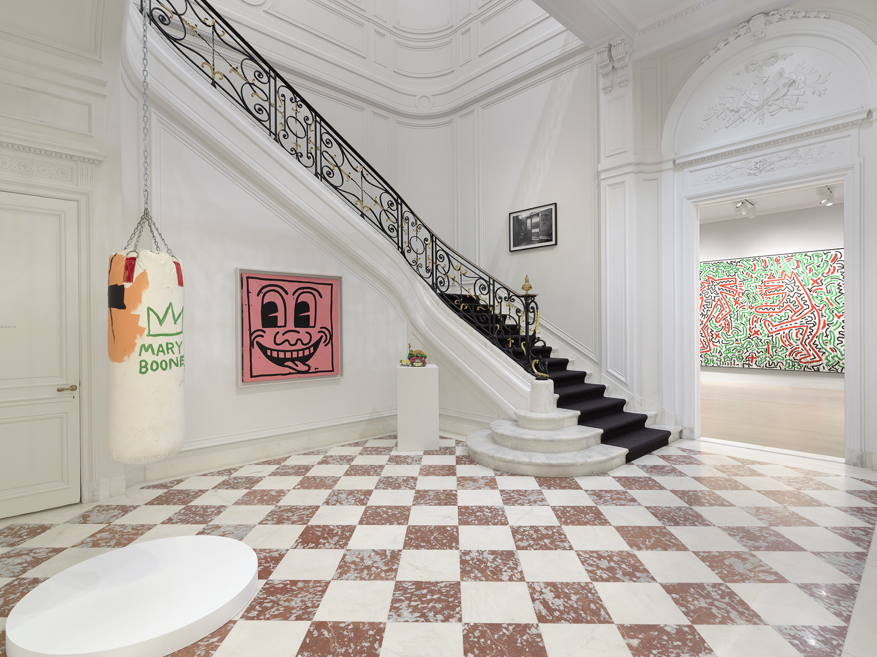 Mary Boone punching bag by Basquiat and staircase. 