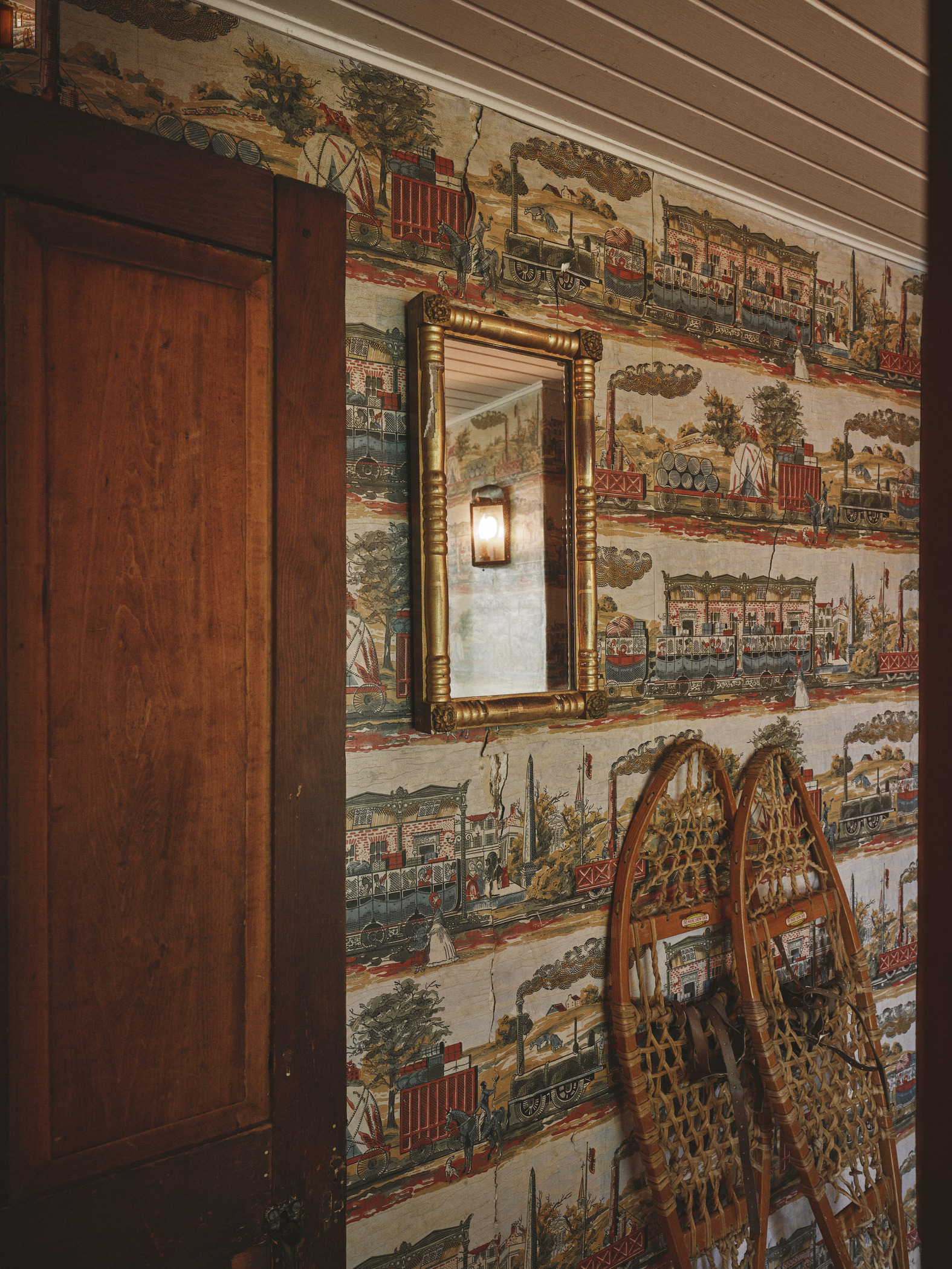 Snowshoes and train-themed wall paper