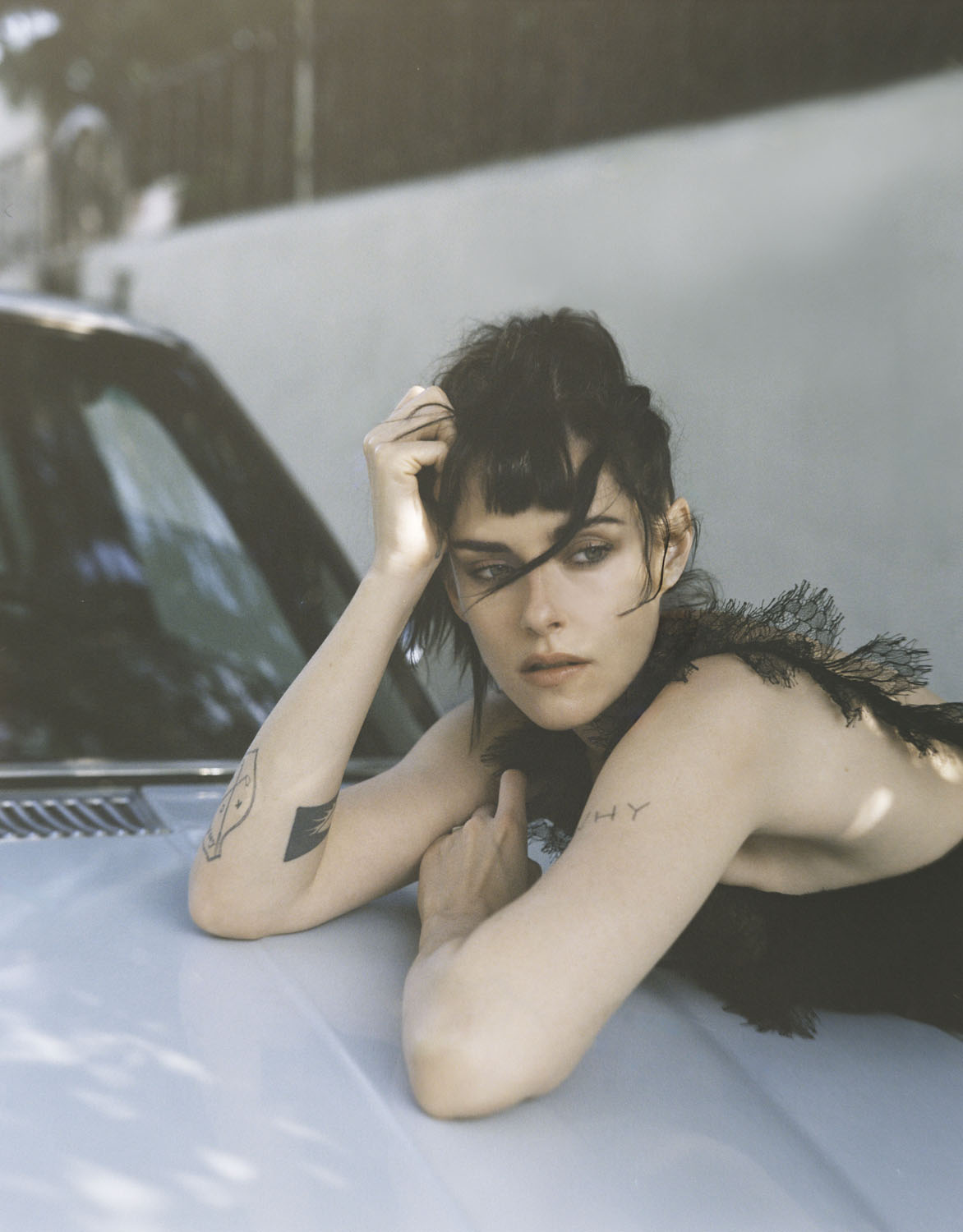 Kristen Stewart wears a dress by Chanel.