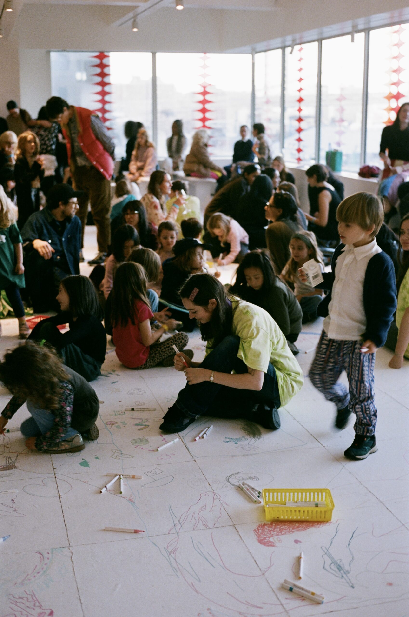 Guests drawing on Ei Arakawa's installation at the Artists & Mothers Gala