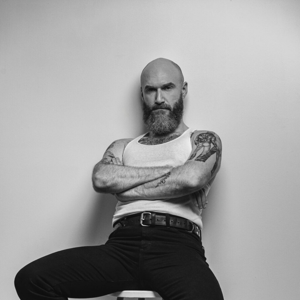 Jonathan Grassi on a stool.