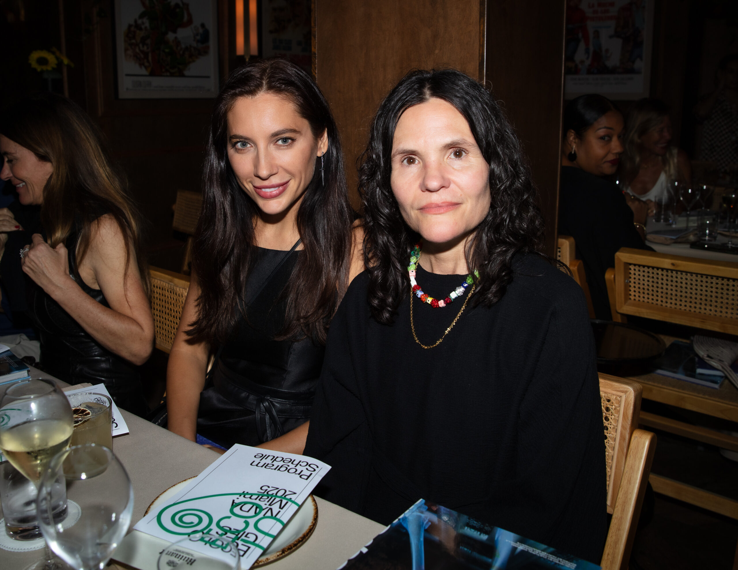 Anastasia Samoylova and Heather Hubbs pose for a photo at dinner