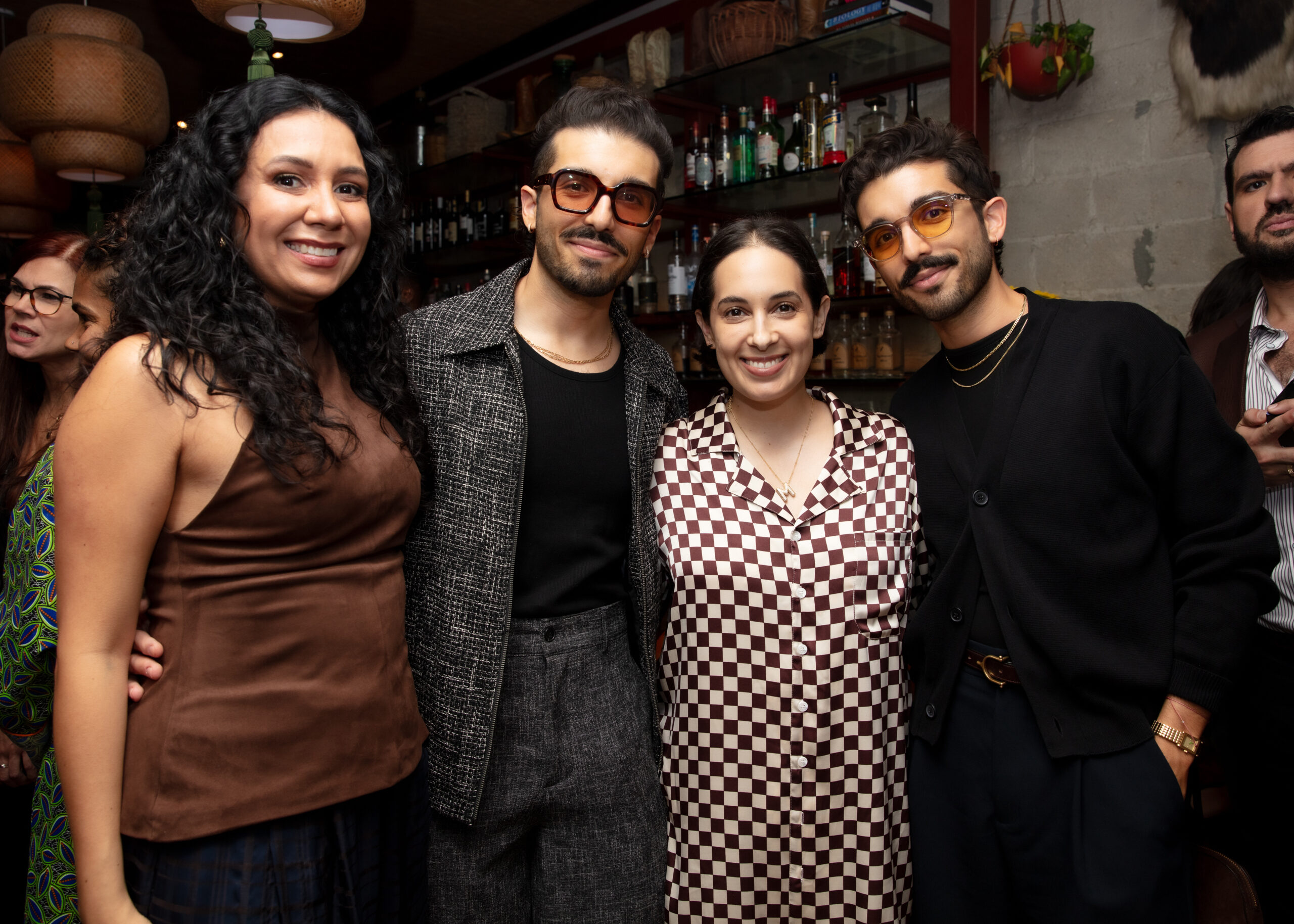 Erick Jimenez, Maritza Lacayo, and Elliot Jimenez pose for a photo for dinner at NADA Miami