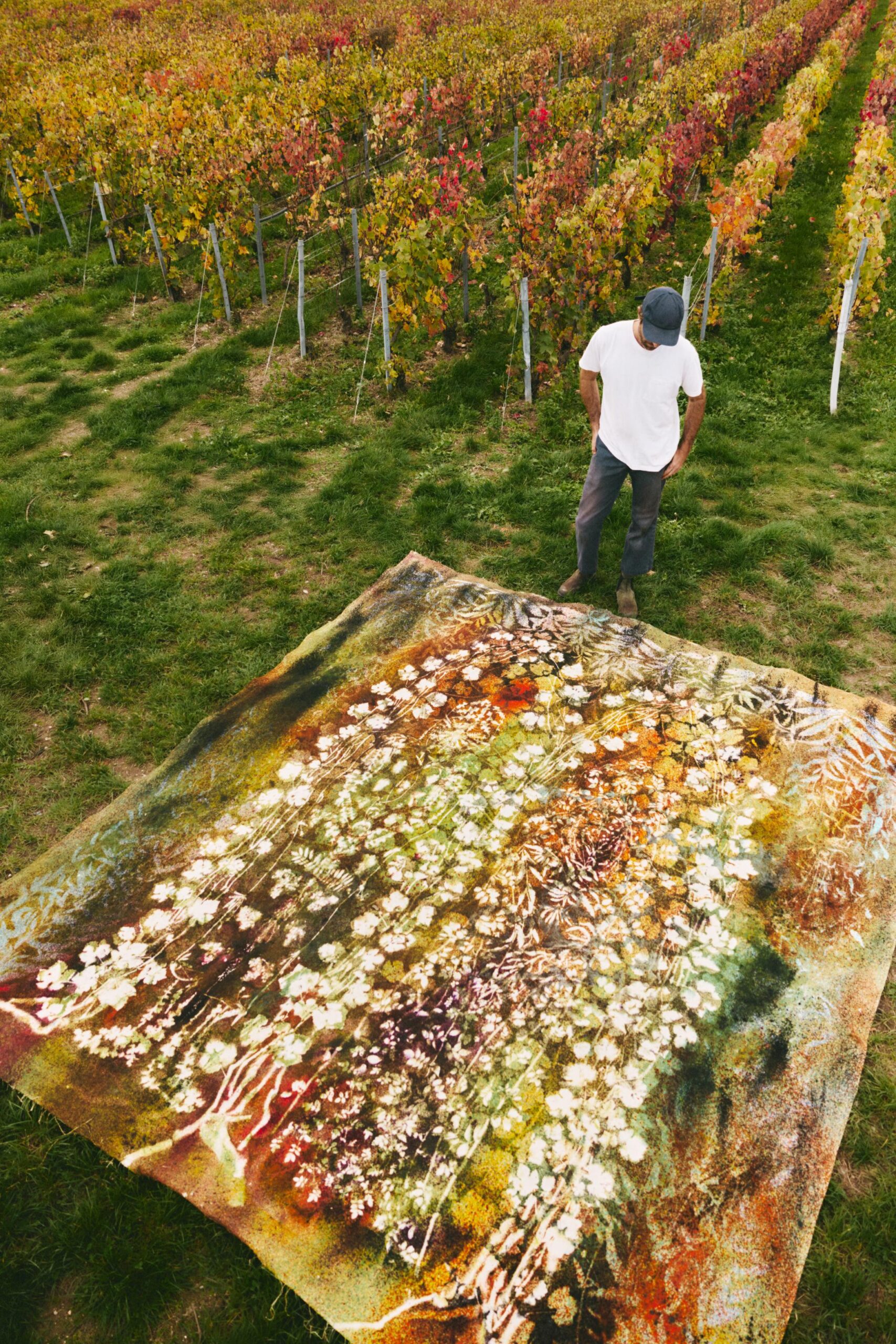 Artist Sam Falls with artwork made for Ruinart