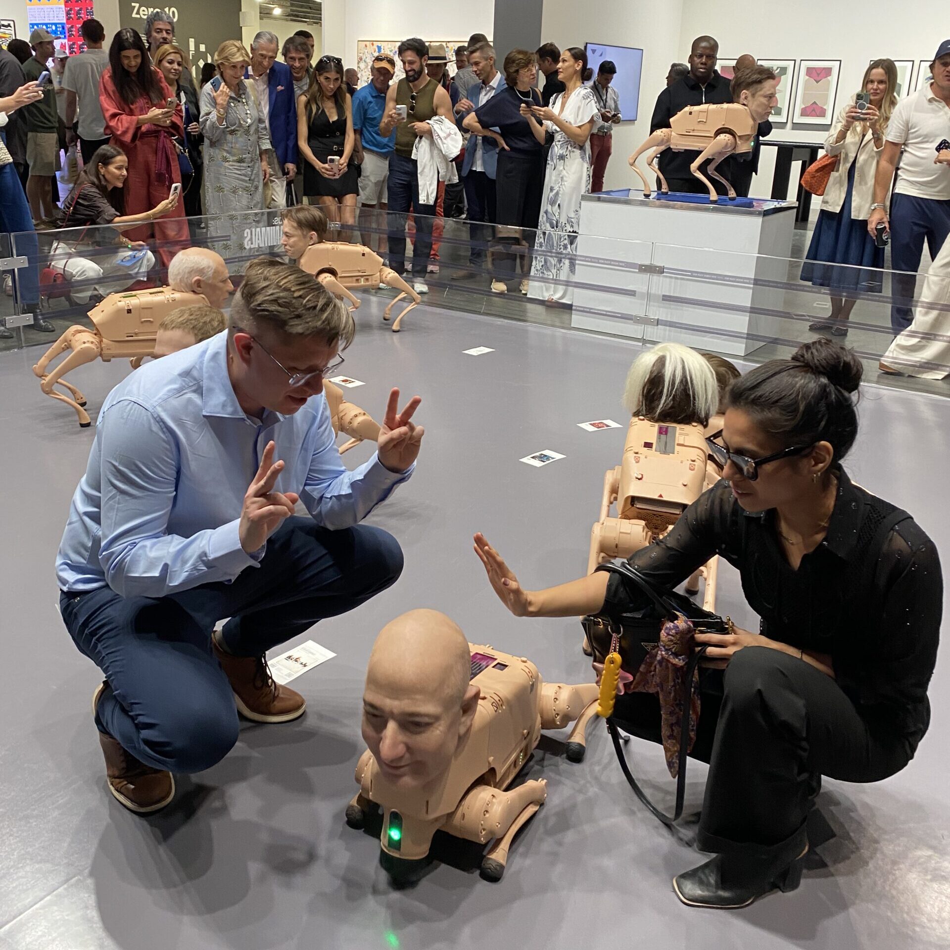 Janelle Zara pets Jeff Bezos.