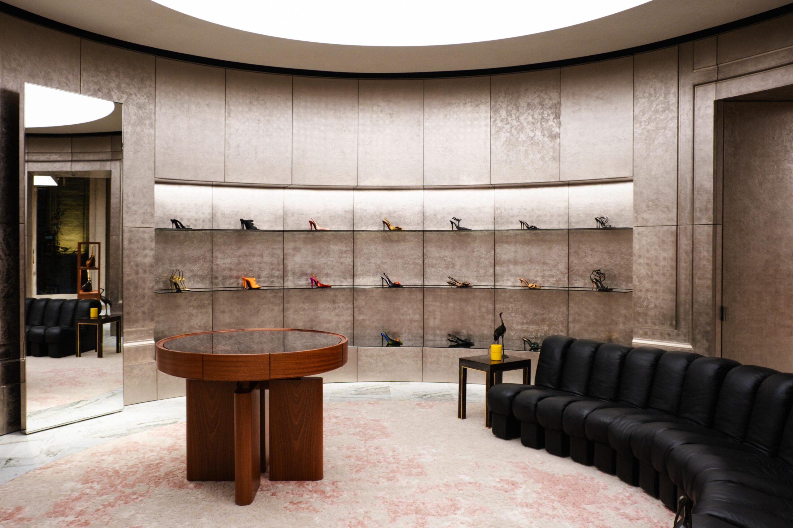 Saint Laurent store, shoe section with table and couch
