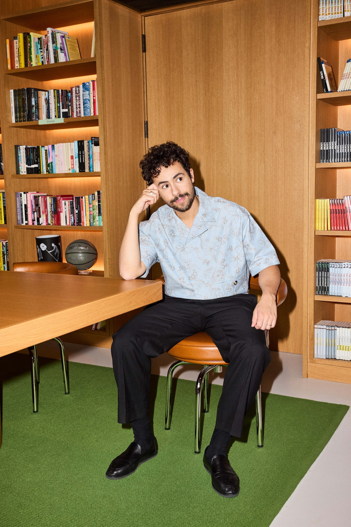 Ramy Youssef wears a top and pants by Hermès, and shoes by Auralee.