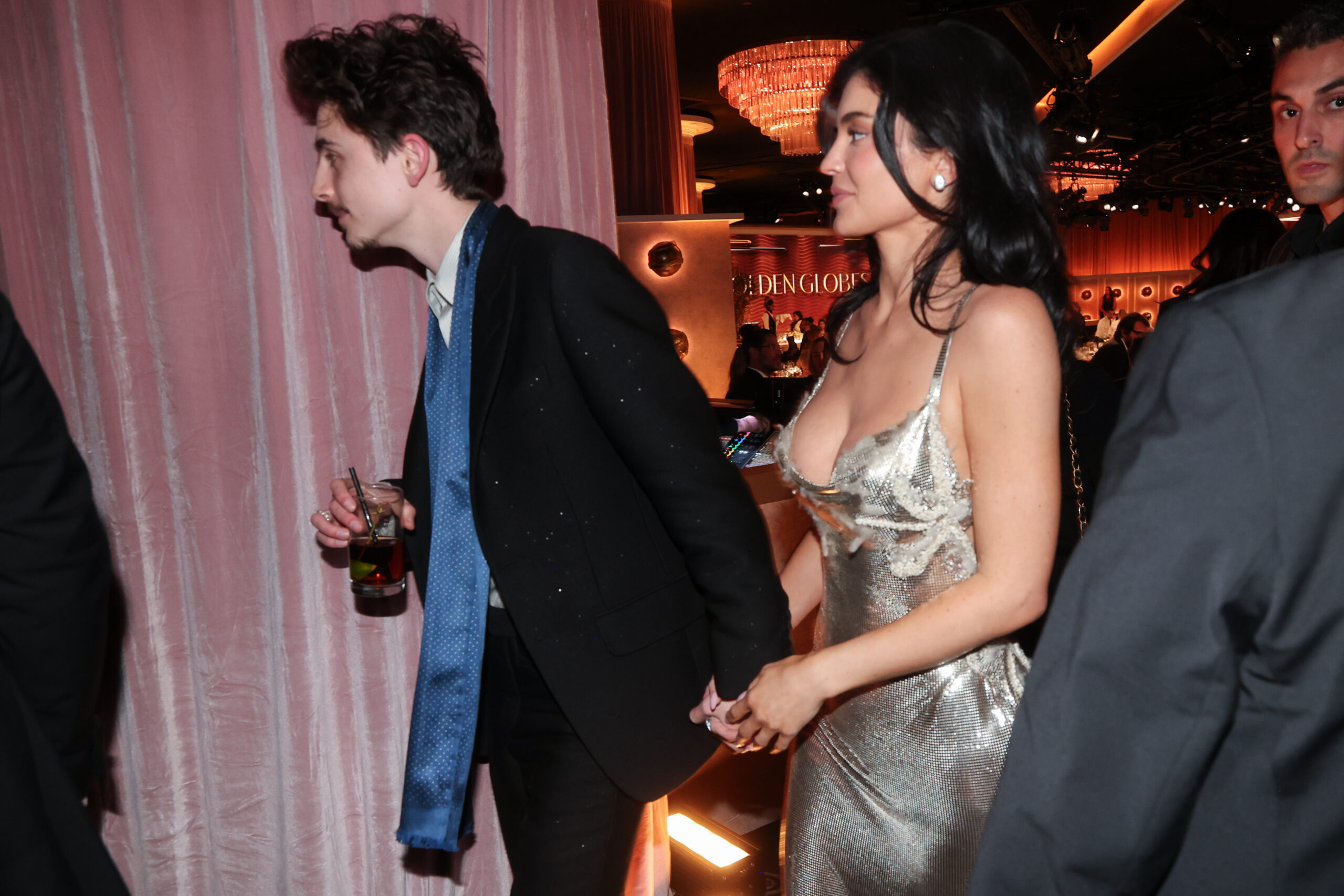 Timothée Chalamet and Kylie Jenner wearing Versace at the 82nd Annual Golden Globes, photography by Christopher Polk/Penske Media, and courtesy of Getty Images