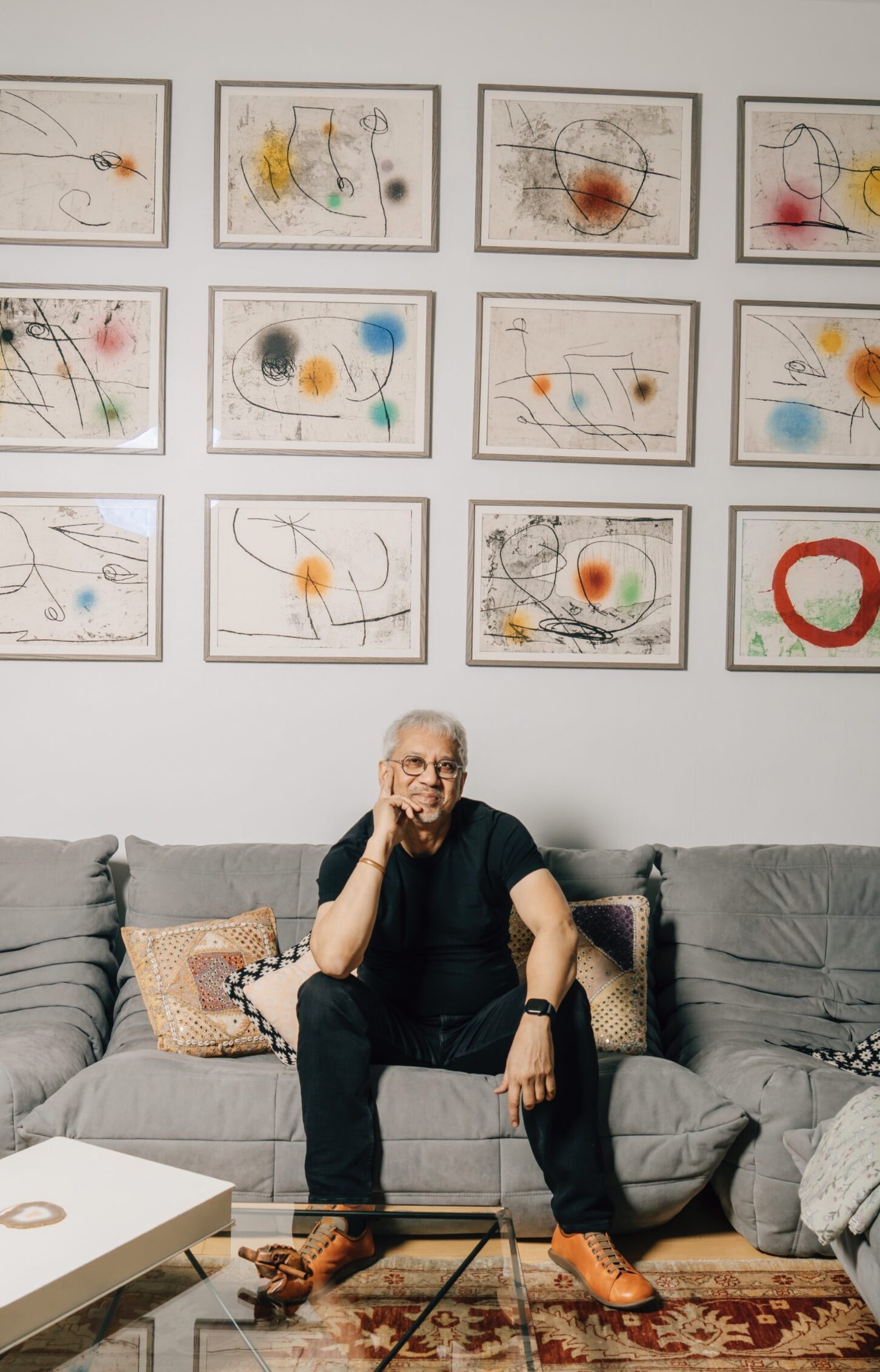 Portrait of Debraj Ray with Joan Miro's Lapidario at his New York apartment