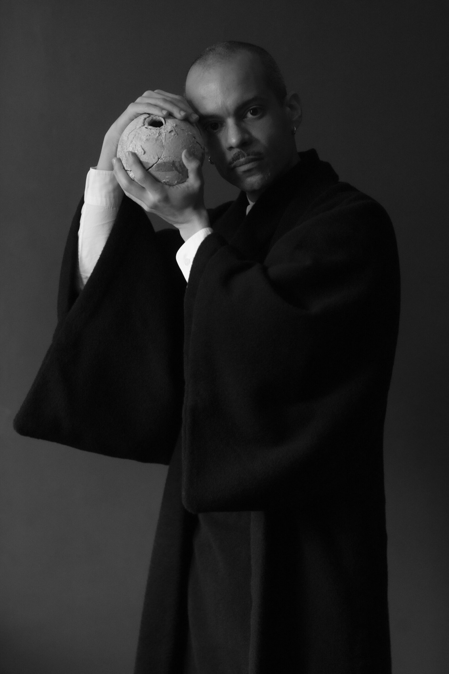 Soto holds an anagama-fired ceramic by Yuji Ueda and wears a Y. & Sons kimono, photo by Michael Avedon