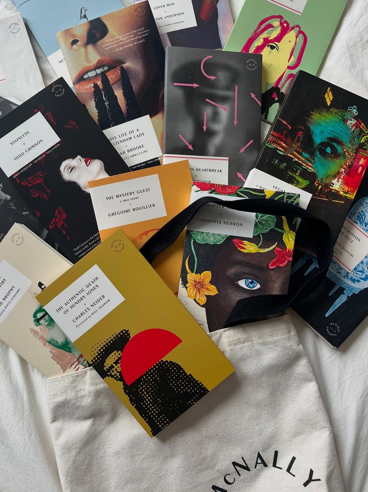 A stylized spread of McNally Editions books, image courtesy of McNally Editions