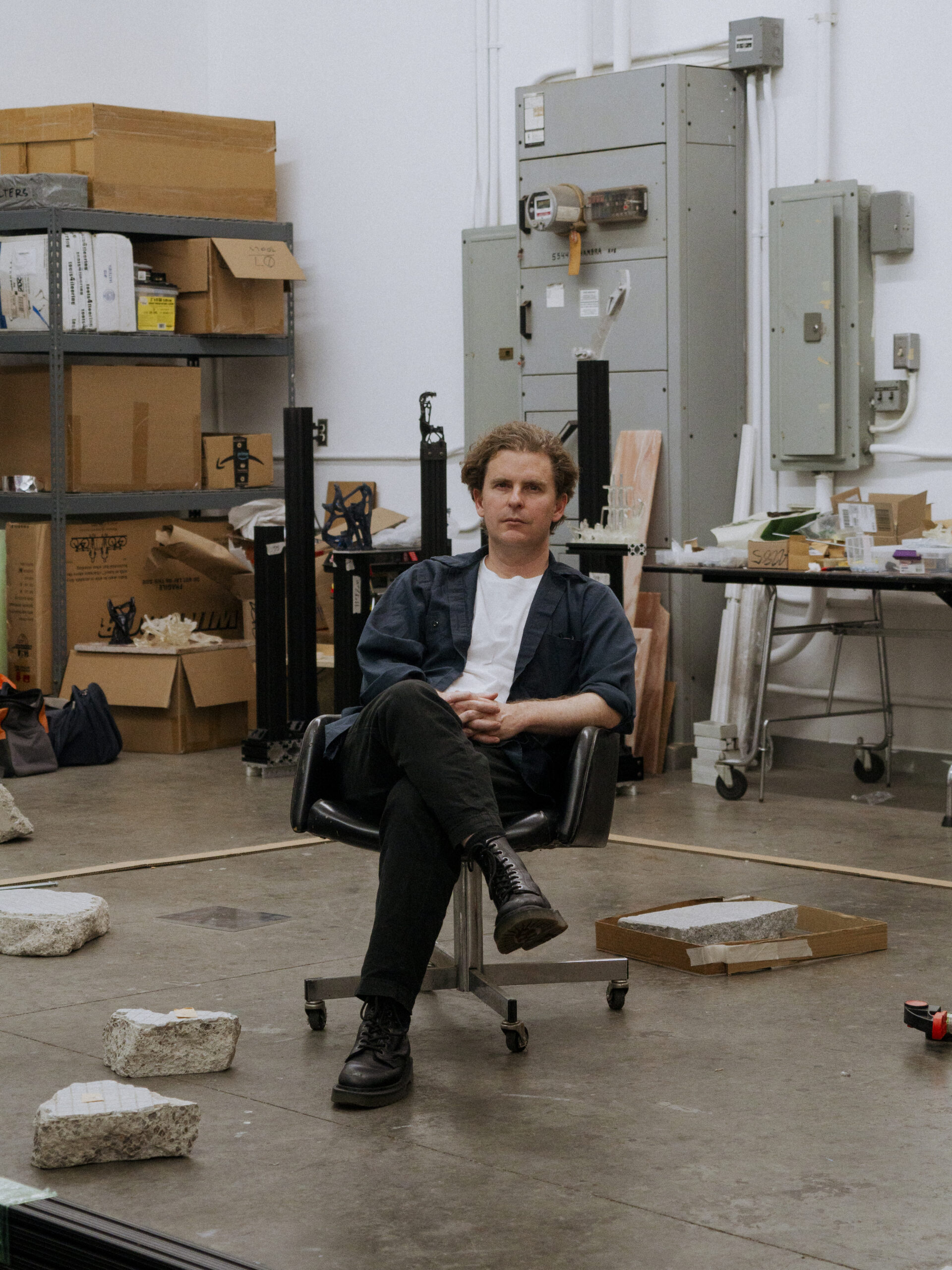 Los Angeles artist and sculptor Cayetano Ferrer sits in his studio