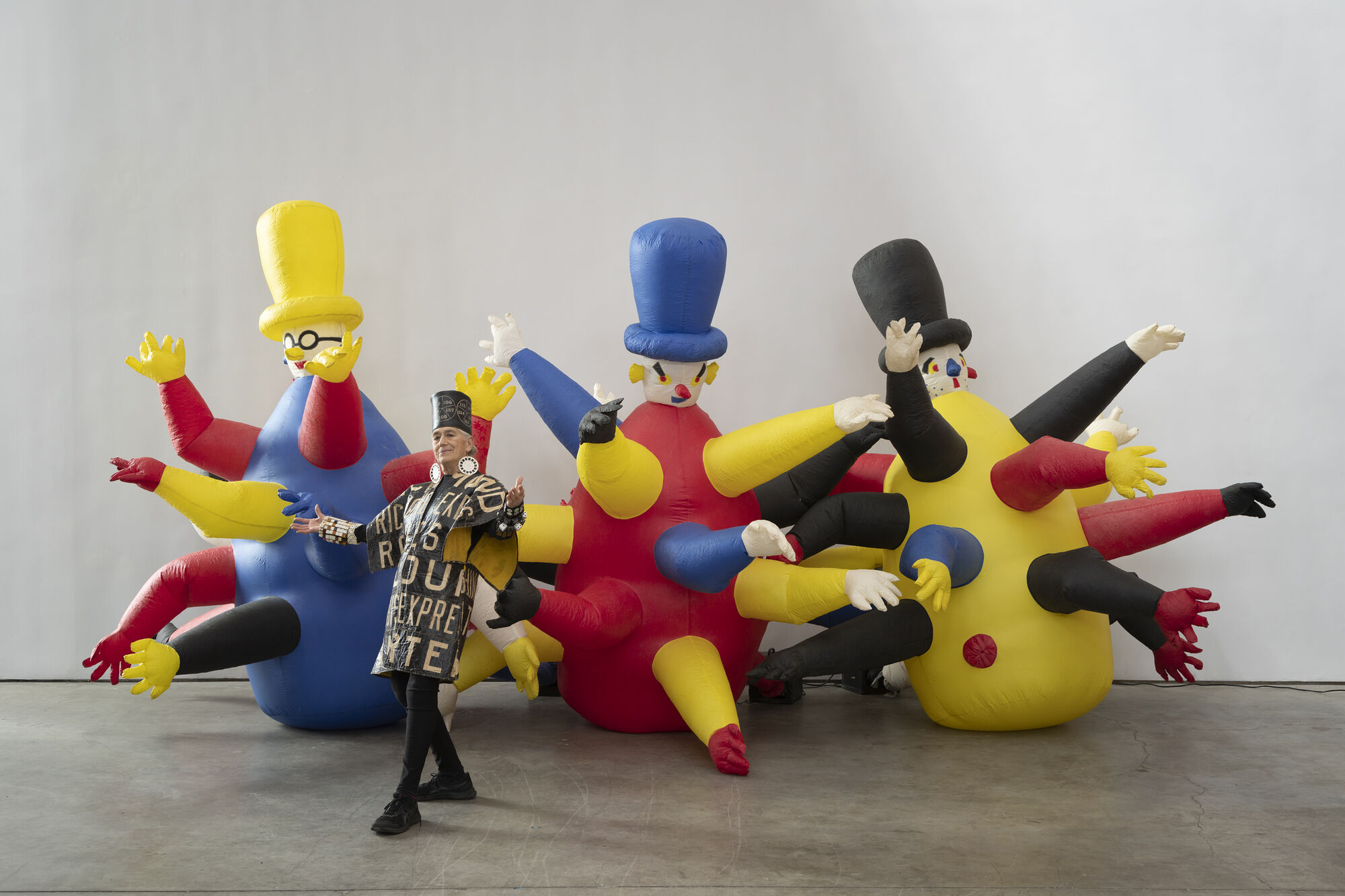 Pat Oleszko in 2025 at SculptureCenter with her inflatable artwork Three Bozos, 1985