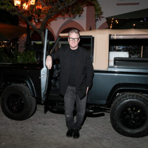 Portrait of Todd Snyder in front of the Balmoral Defender car