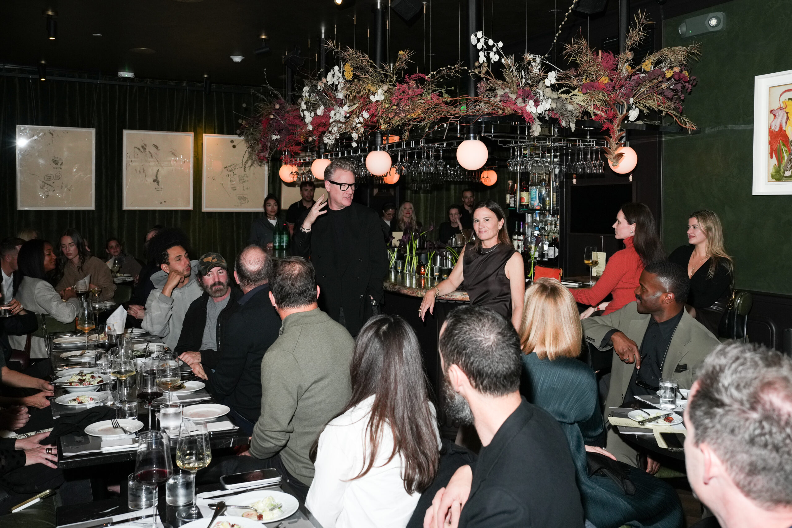 Todd Snyder and Sarah Harrelson addressing the attendees at the Todd Snyder dinner with the Balmoral Defender