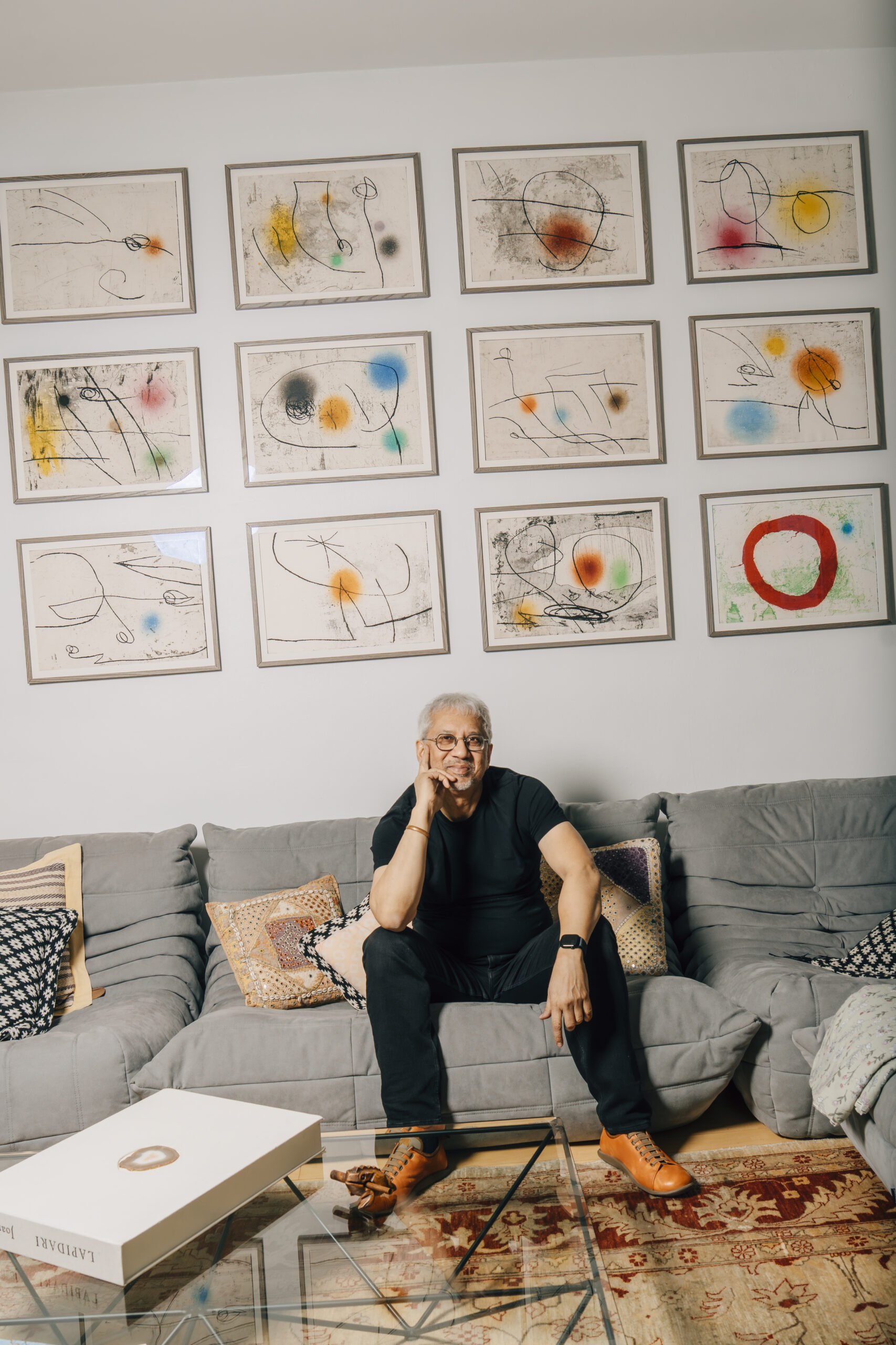 Portrait of Debraj Ray with Joan Miro's Lapidario at his New York apartment