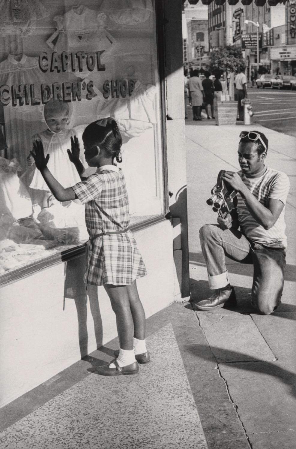 Doris A. Derby, Member of Southern Media Photographing a Young Girl, Farish Street, Jackson, Mississippi, 1968. © Doris A. Derby.