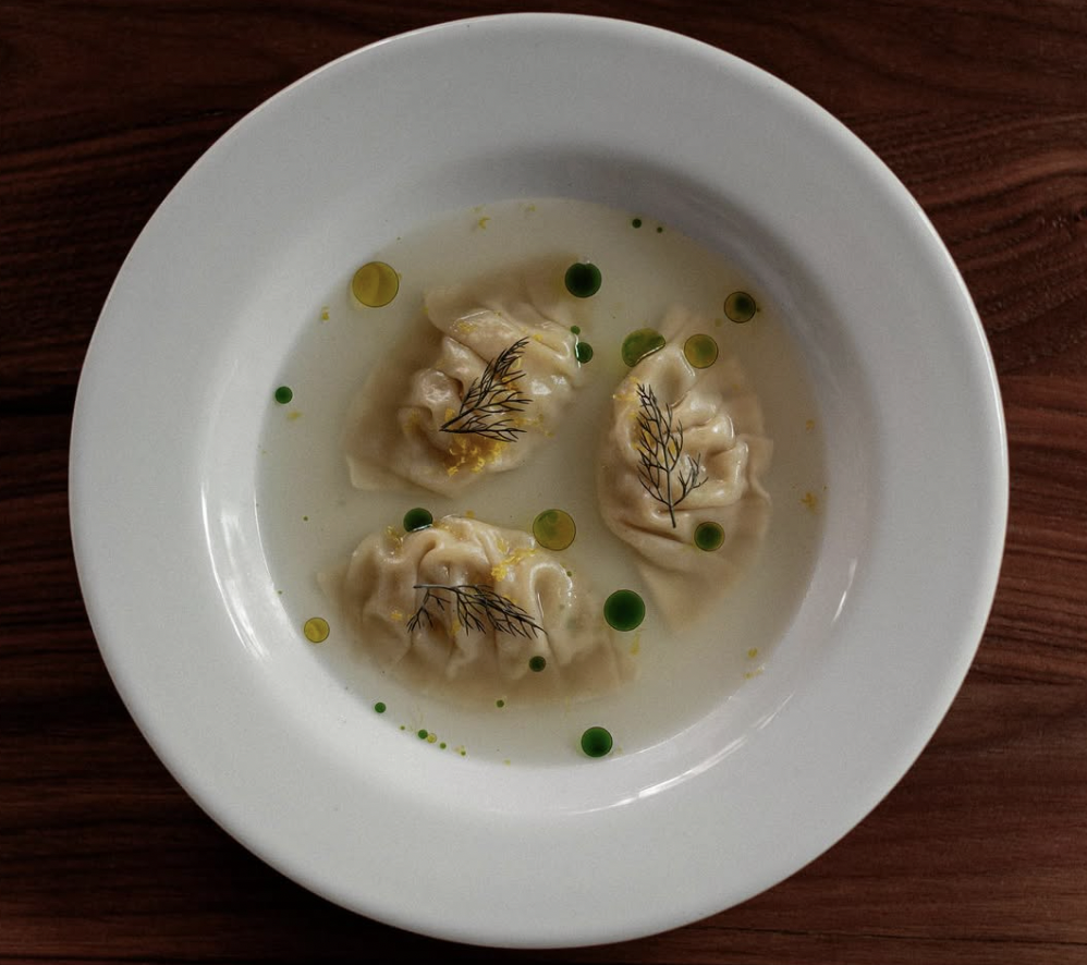 A bowl of parsnip dumplings with garnish at Mexico City restaurant Cana