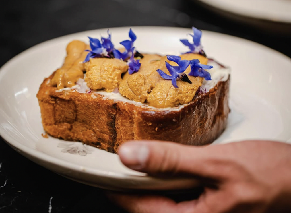 A plate of sea urchin toast at the restaurant Máximo Bistrot in Mexico City