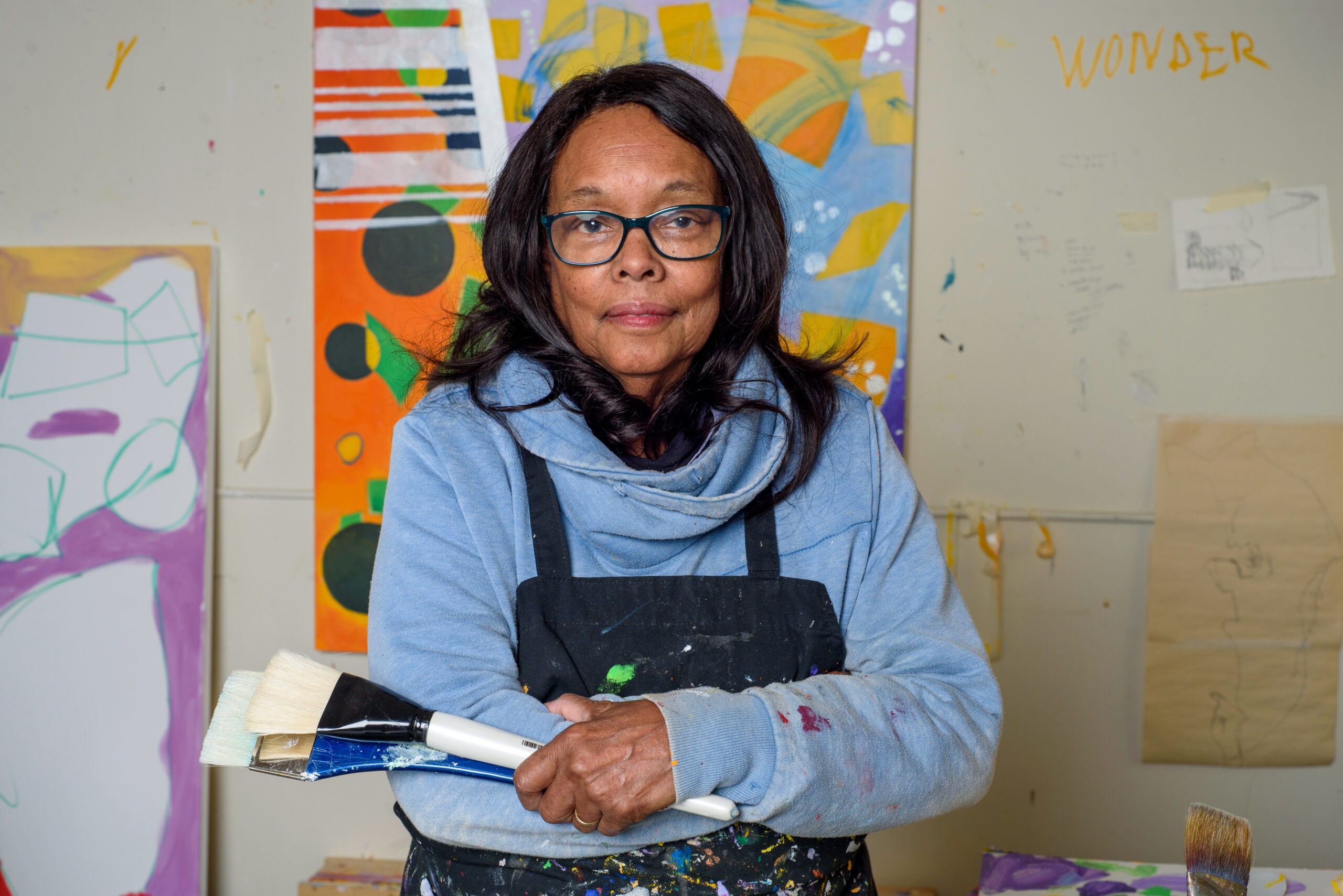 Portrait of artist Cynthia Hawkins in her studio