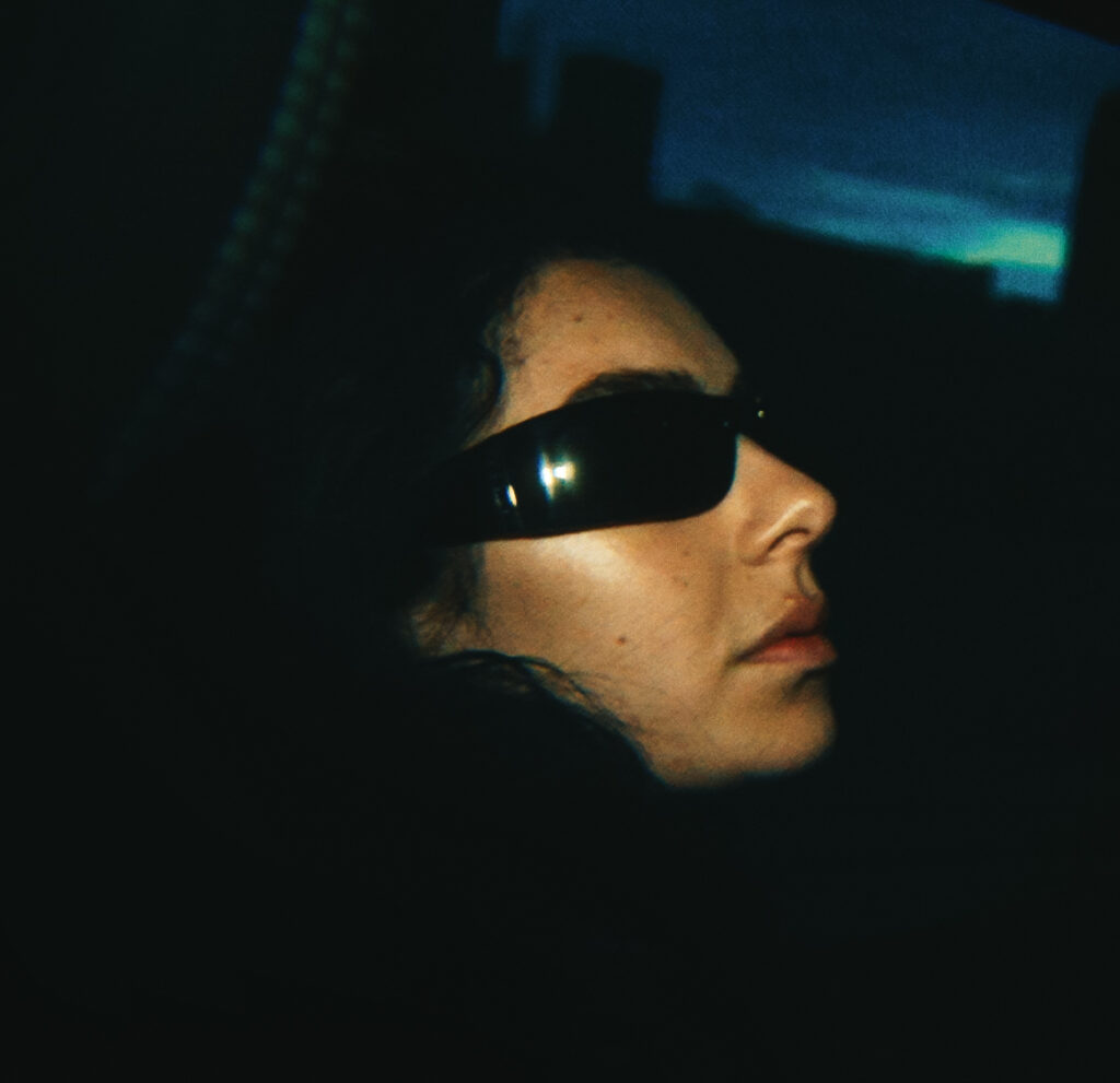 Charli XCX in a still from the movie The Moment.