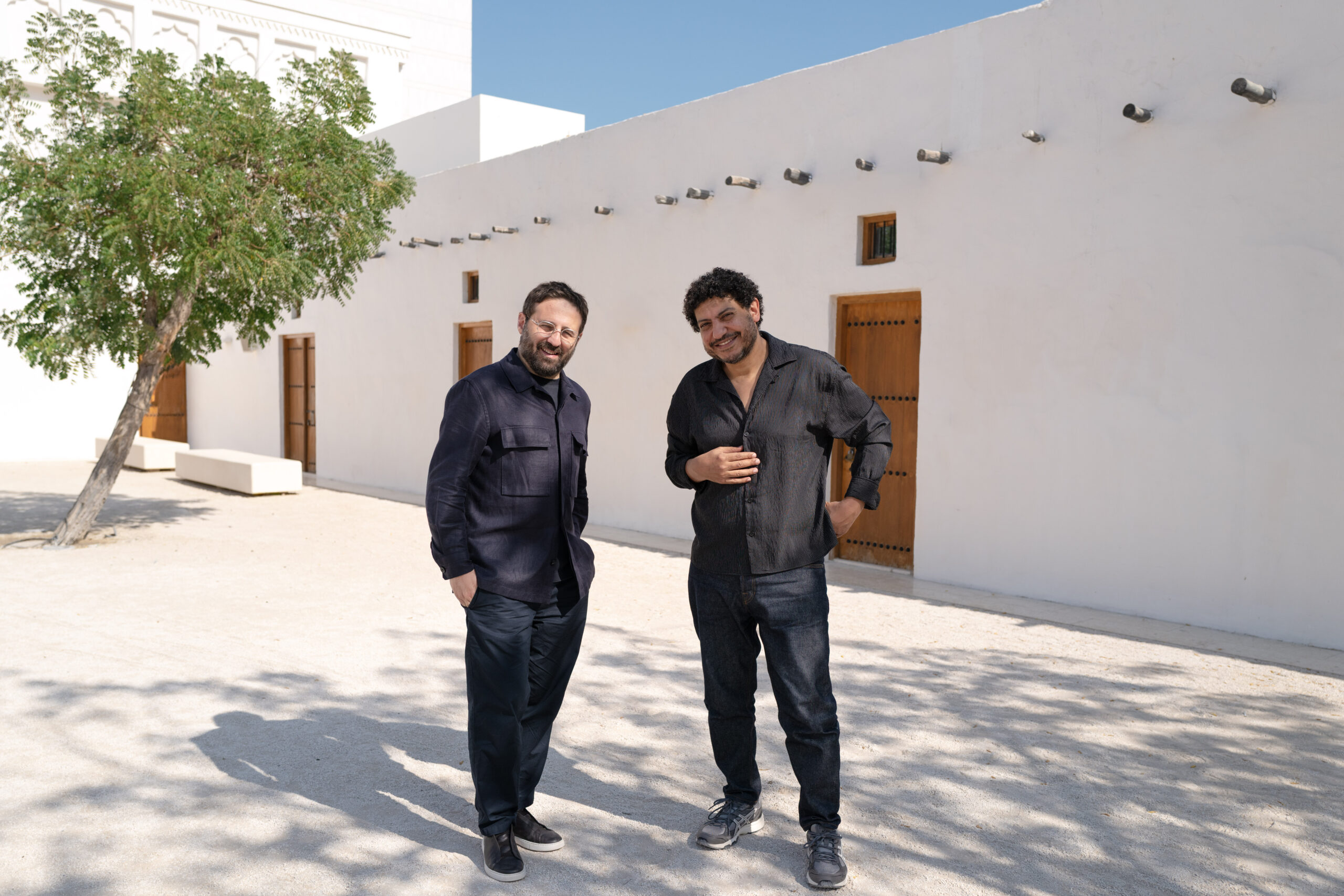 Vincenzo de Bellis and Wael Shawky stand for a portrait at Art Basel Qatar