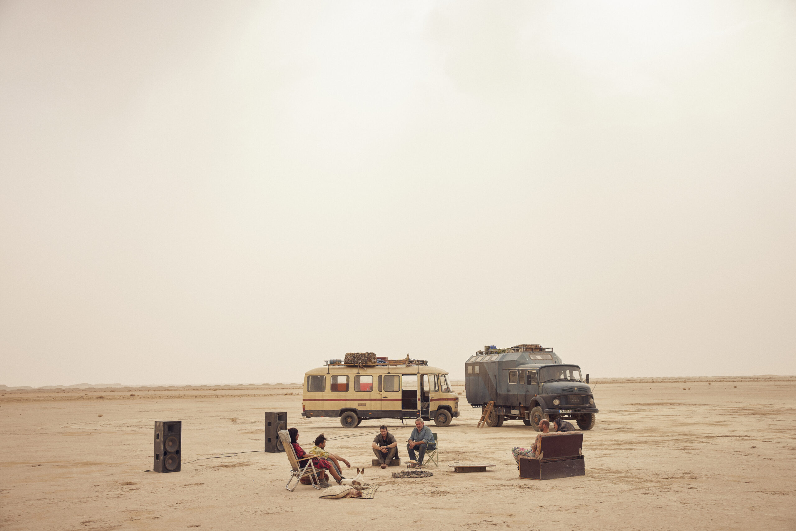 Two military vehicles out in the Moroccan desert in the Oliver Laxe film Sirat.