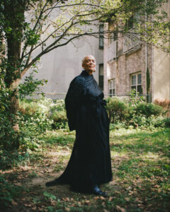 Portrait of artist Maren Hassinger in a garden