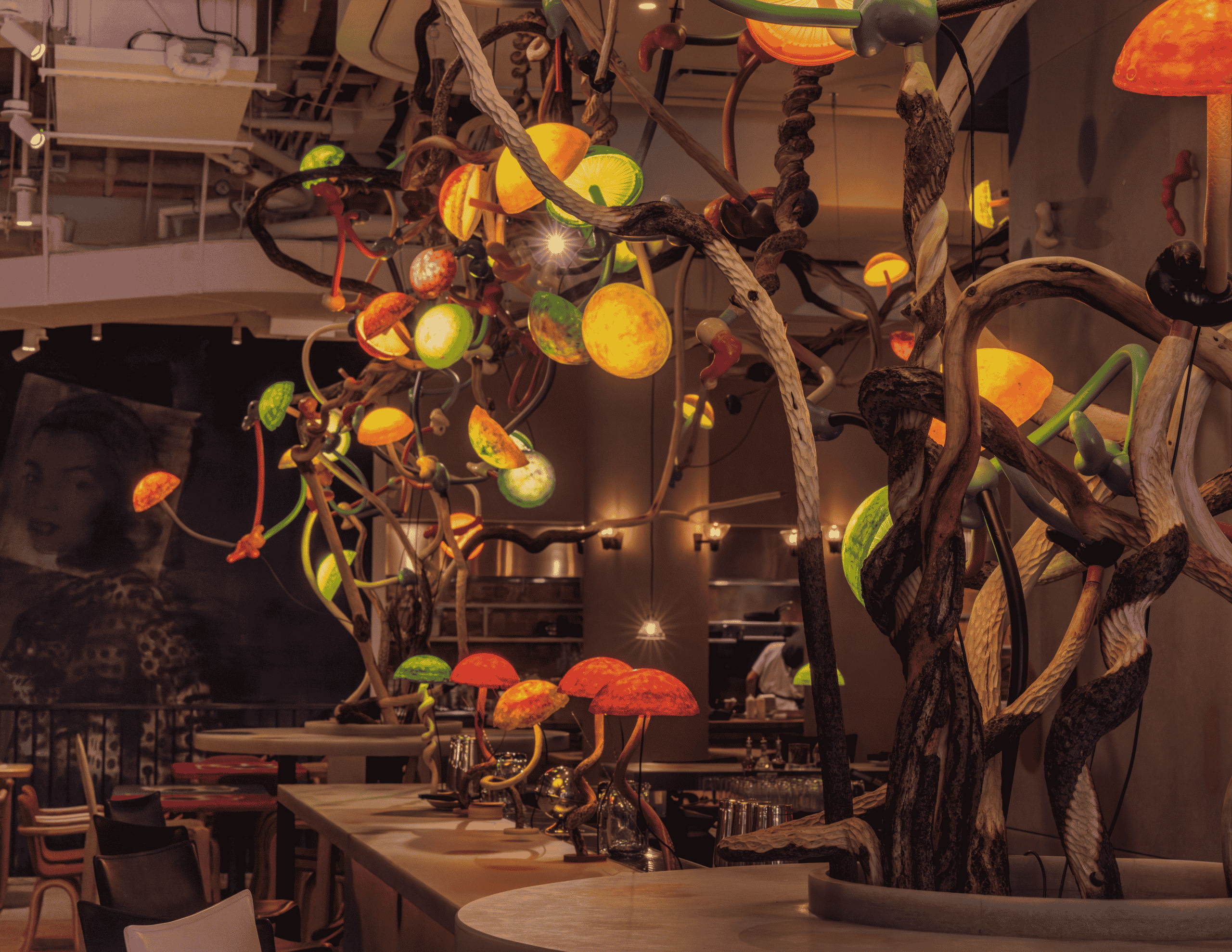 The chandelier designed by artist Mika Rottenberg weaves through the restaurant Manuela in SoHo