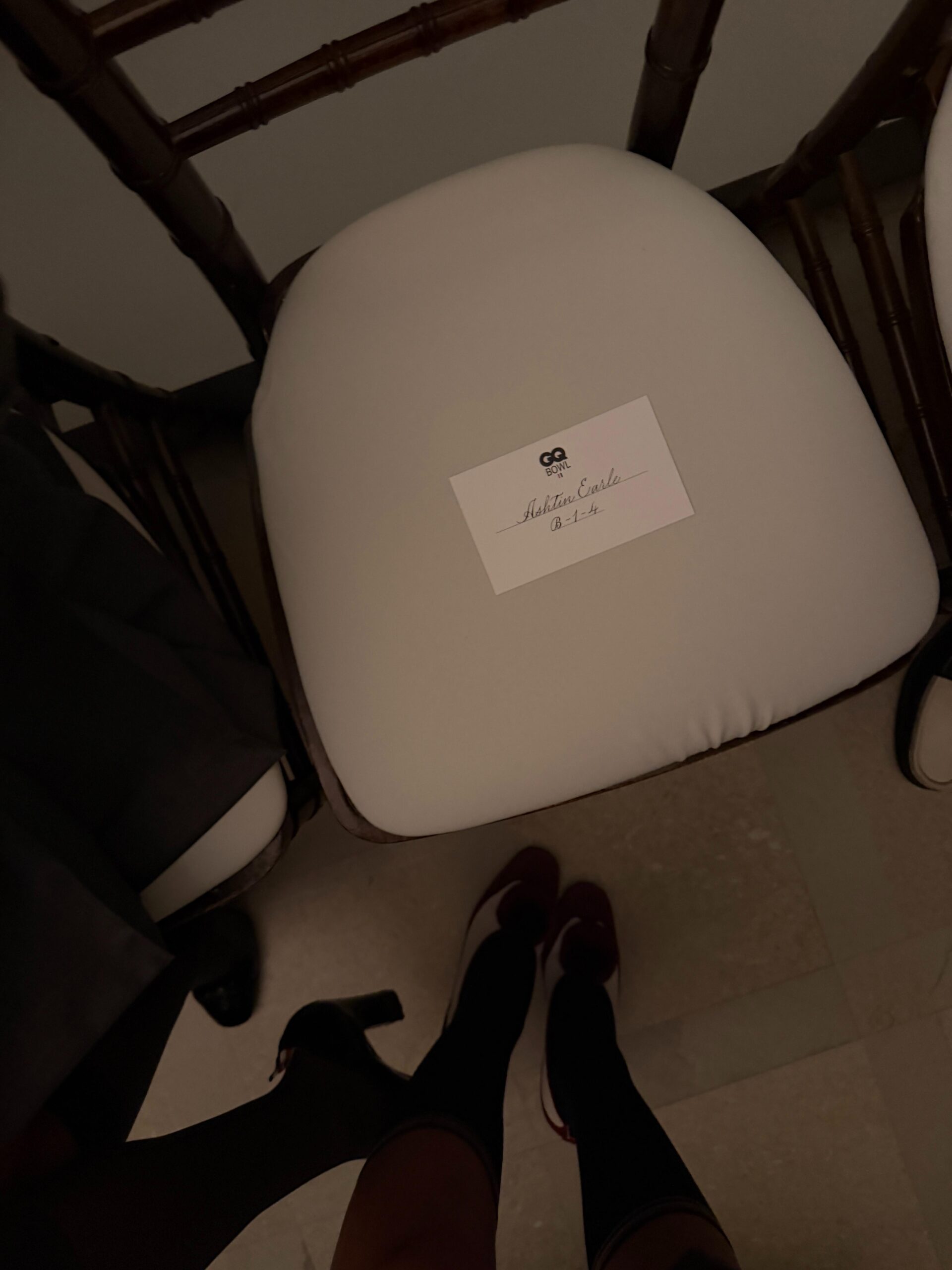 Ashtin Earle shows her seat inside the Thom Browne Fall/Winter 2026 show