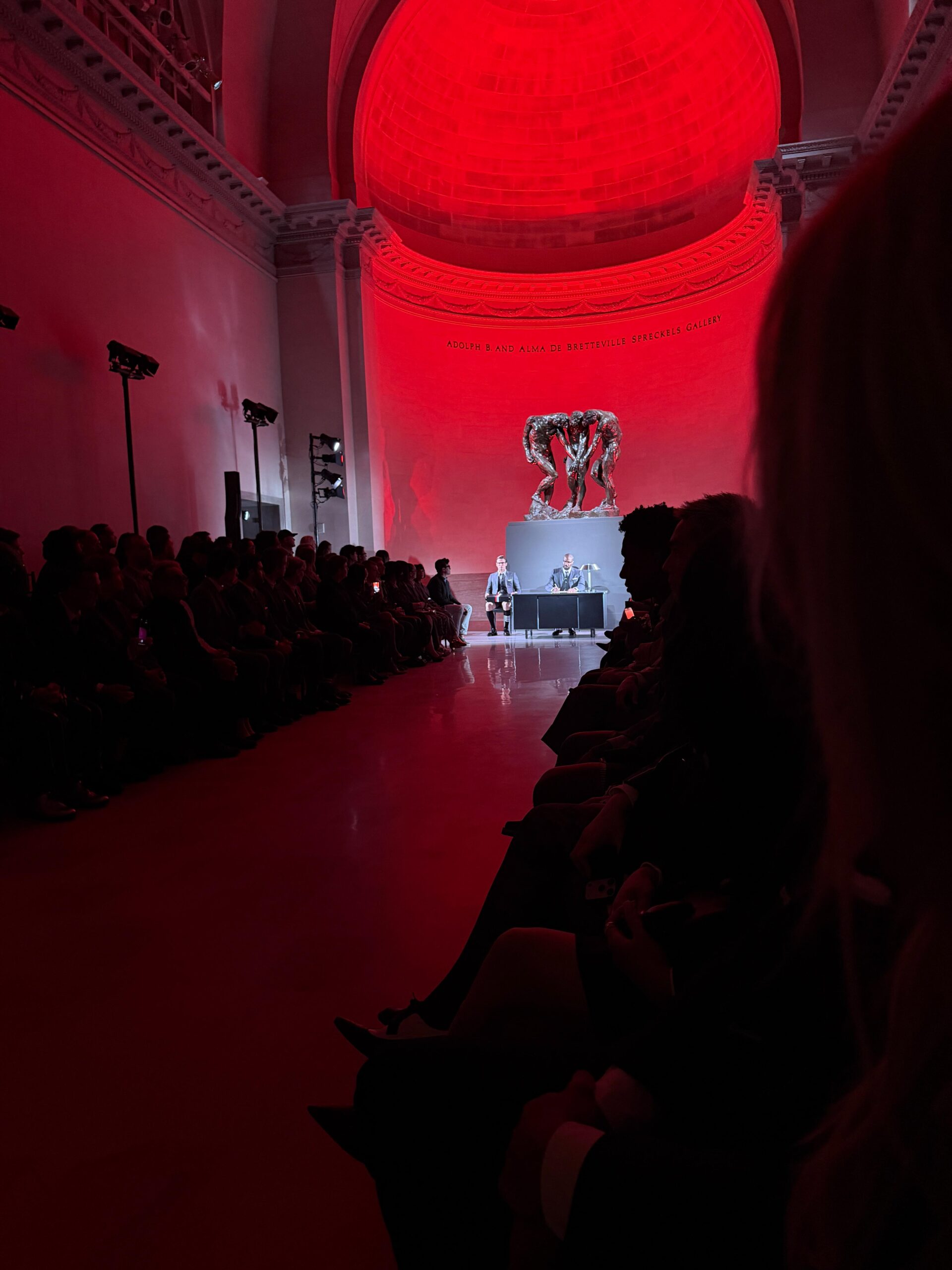 Ashtin Earle snaps a shot of the runway at the Thom Browne Fall/Winter 2026 show